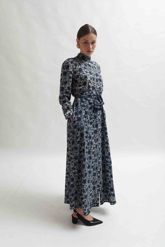 Silk shirt dress with Ajrakh block print by Obidi, crafted from upcycled antique saris. Features a mandarin collar, side pockets, and matching belt. Handcrafted, one-of-a-kind piece from the House of Woven Stories collection.