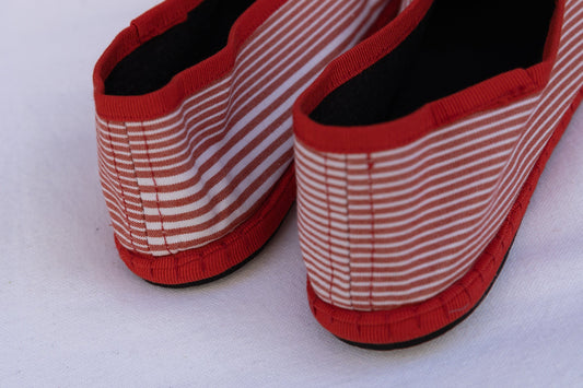 Red White Striped Venetian Slippers by Teod’amar, handmade in Venice from upcycled luxury fabrics and recycled bicycle tyres. Unique, eco-conscious, and timelessly elegant.