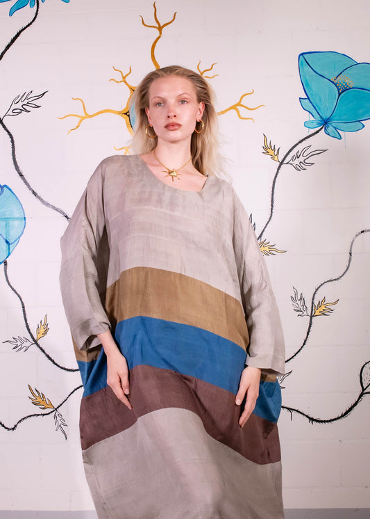 Ankle-length colour-blocked blouson dress by A Sacred Wrap, featuring hand-dyed botanical hues in patchwork design. Made in Mumbai from natural fibers, combining fluid silhouette with ethical craftsmanship.