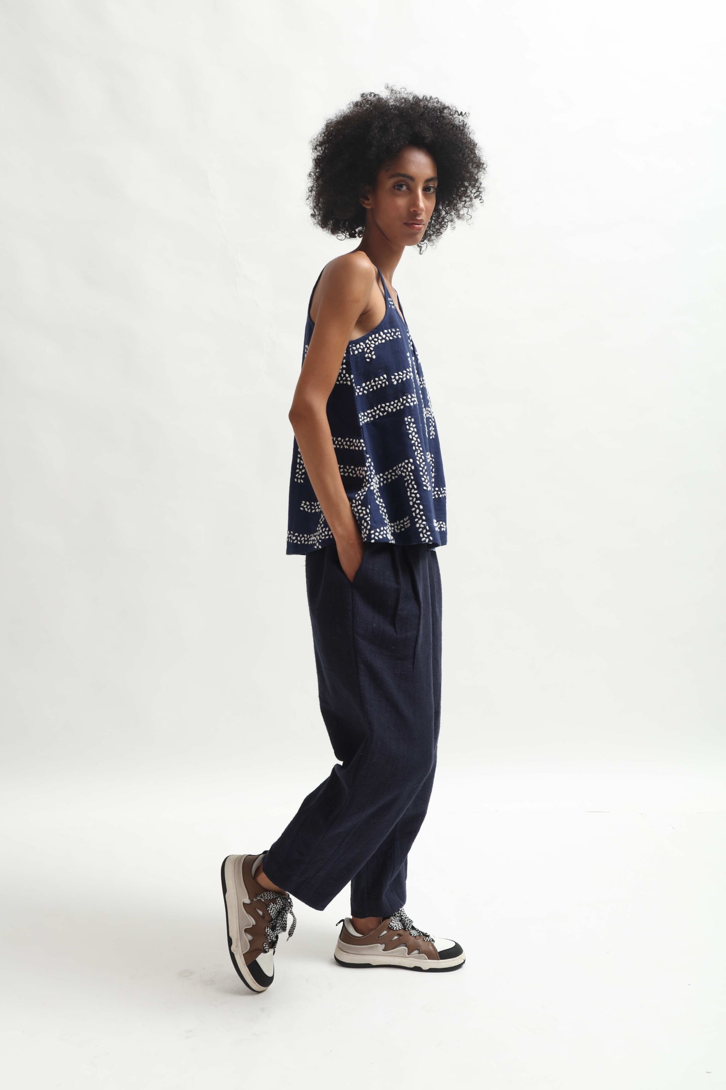 Navy Tulip Hem Trousers by Paiwand, crafted from upcycled handwoven indigo cotton waste. Sustainable, ethically handmade trousers blending traditional weaving with modern style.
