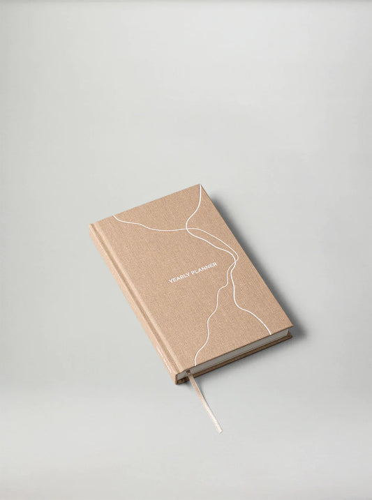 Sand Yearly Planner by New Mags, undated minimalist planner with monthly and daily pages.