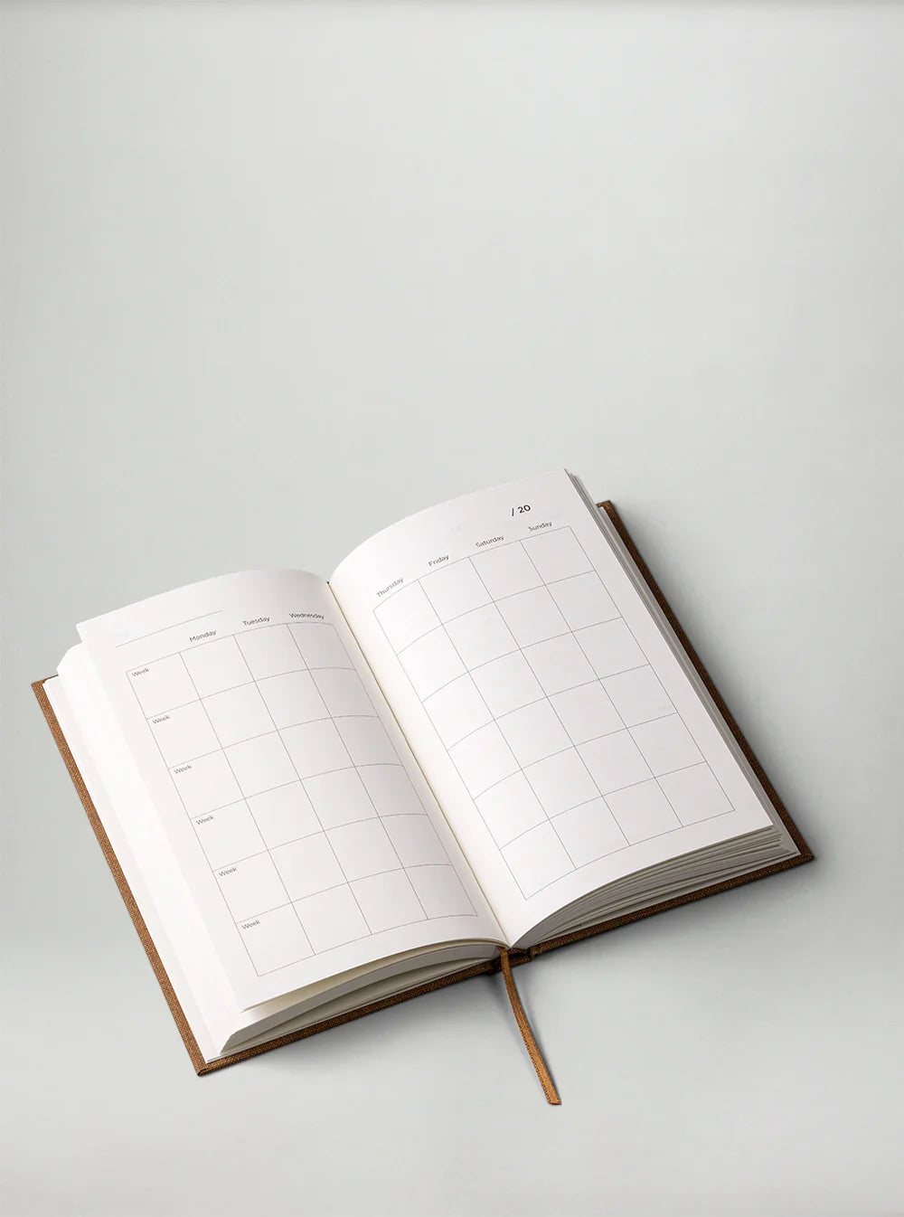 Sand Yearly Planner by New Mags, undated minimalist planner with monthly and daily pages.