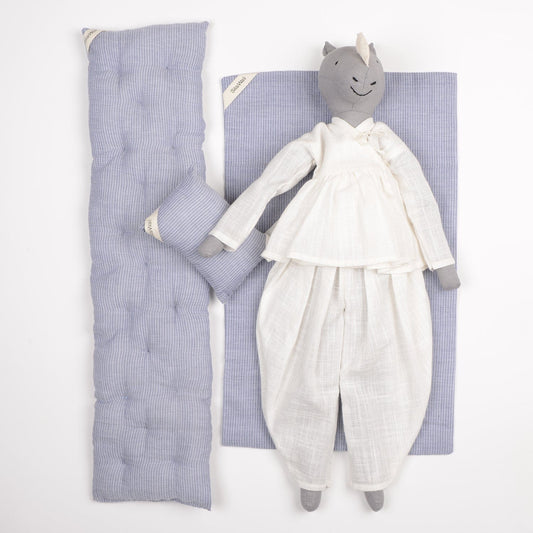 Ura handcrafted rhinoceros cloth doll made from upcycled fabric by SilaiWali, with bedding in foldable box. Available at House of Woven Stories.