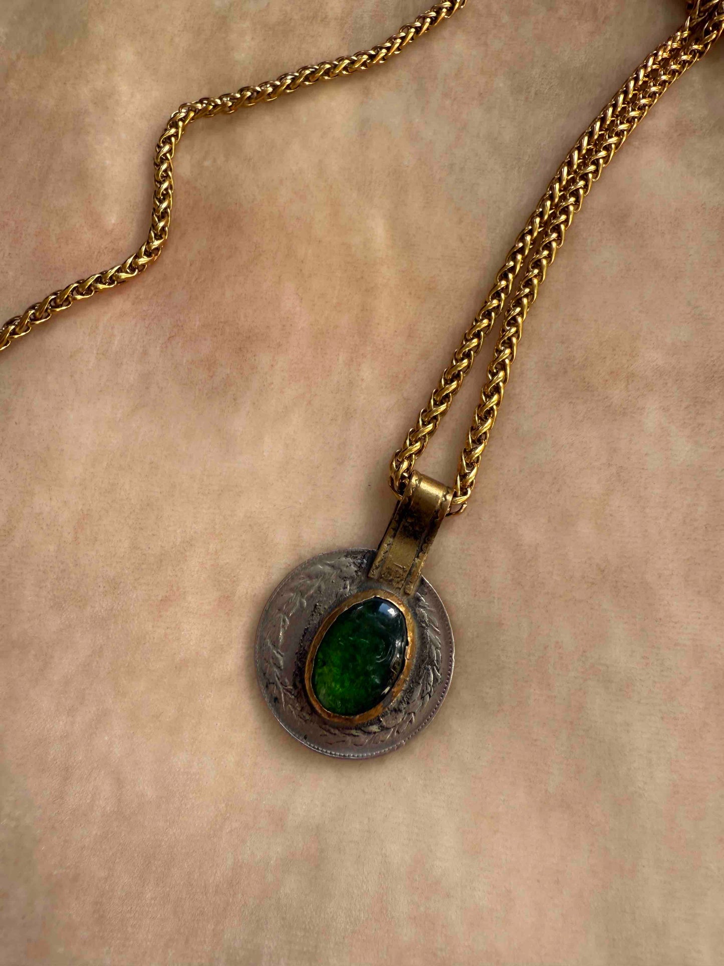 Bold Urban Tribe Ring Pendant by Ilaria Fiorentini Jewellery, blending ethnic and modern design. Handcrafted in Italy with red bamboo coral, turquoise paste, amber resin, brass, wood, leather, and a brass medallion. Part of House of Woven Stories selection.