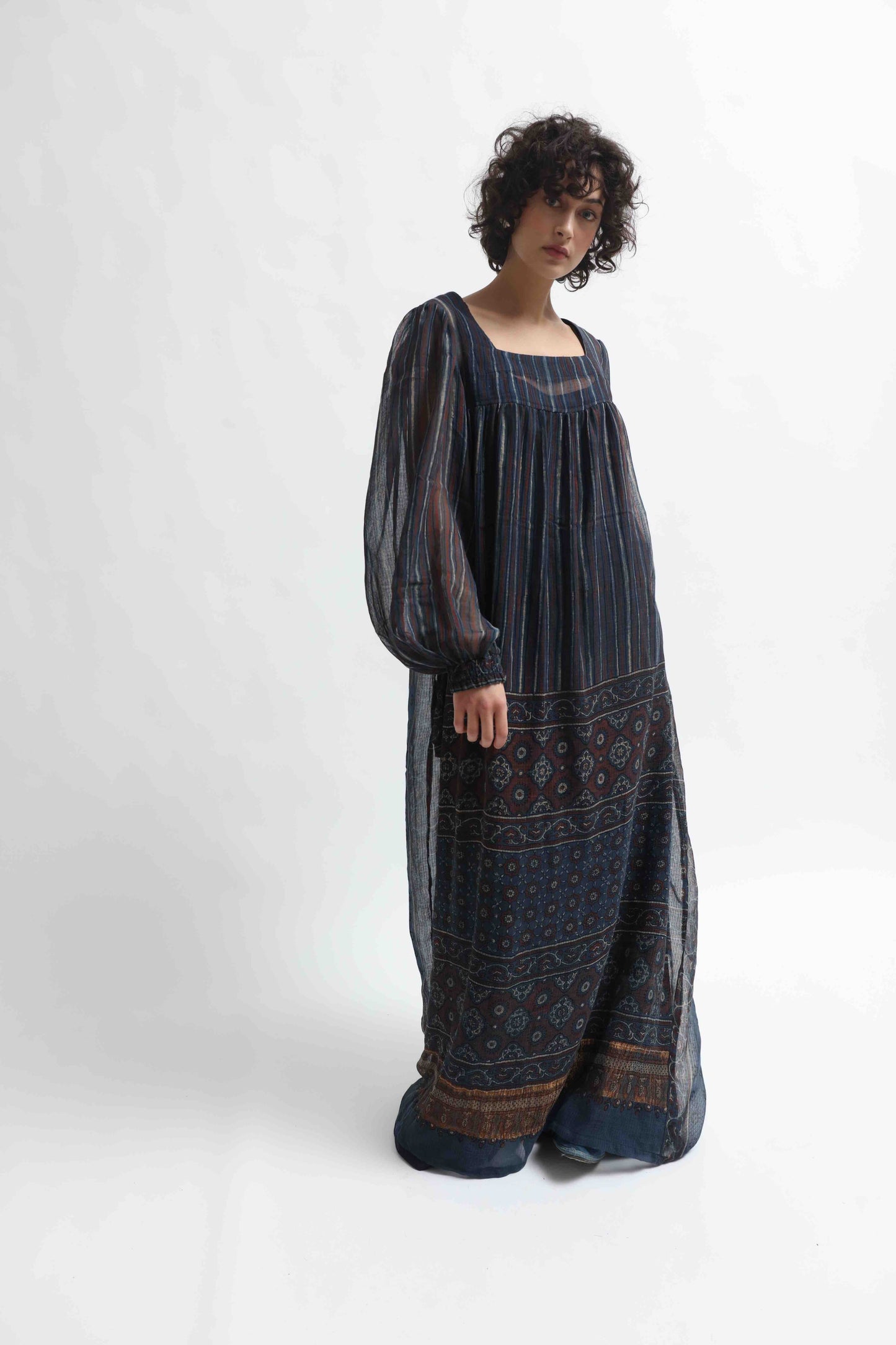 Woodstock Dress by House of Woven Stories - long dress in 100% cotton gauze, crafted from handprinted sari patchwork with intricate Ajrakh block prints. Lightweight, flowing, artisanal, and one-of-a-kind.