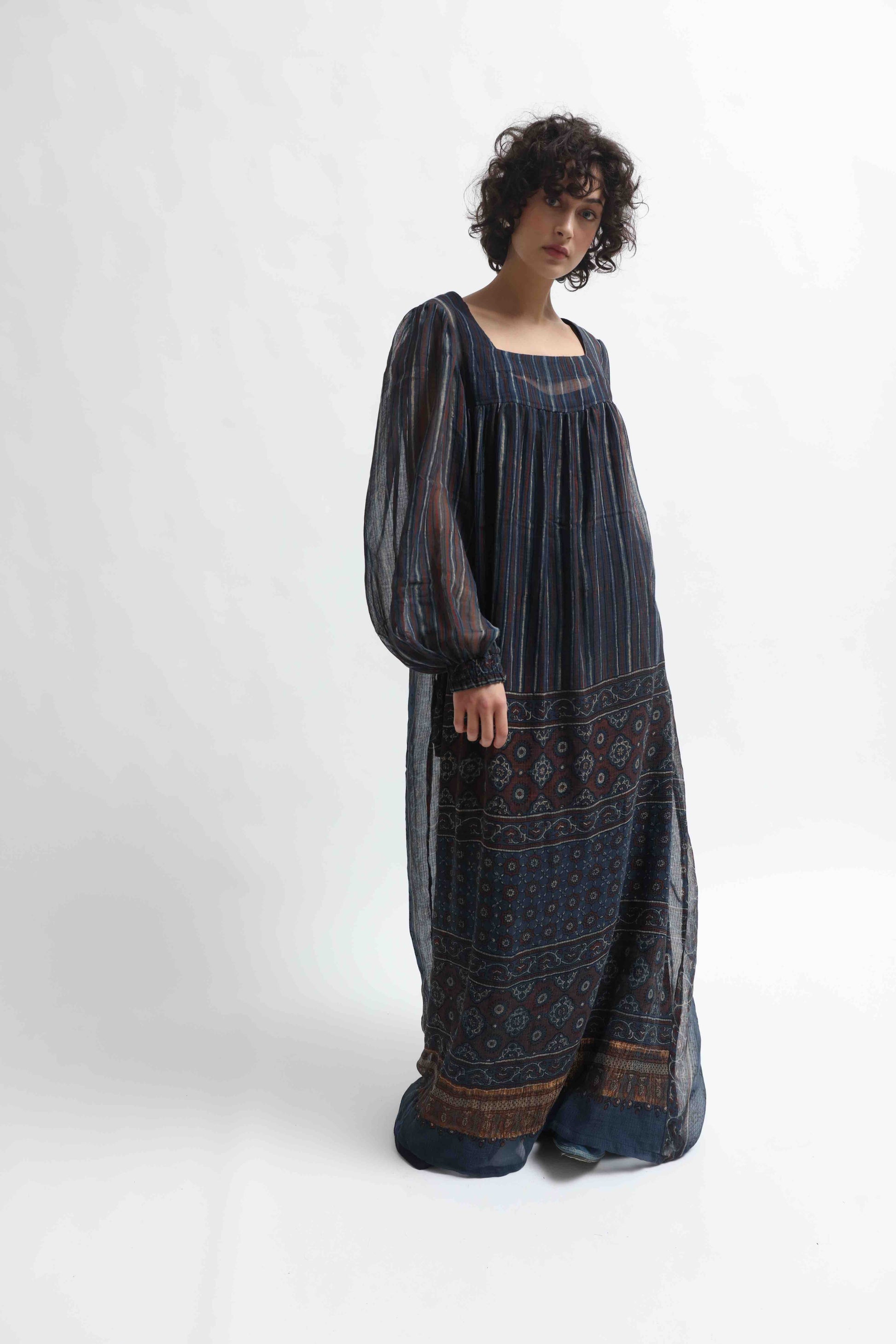 Woodstock Dress by House of Woven Stories - long dress in 100% cotton gauze, crafted from handprinted sari patchwork with intricate Ajrakh block prints. Lightweight, flowing, artisanal, and one-of-a-kind.