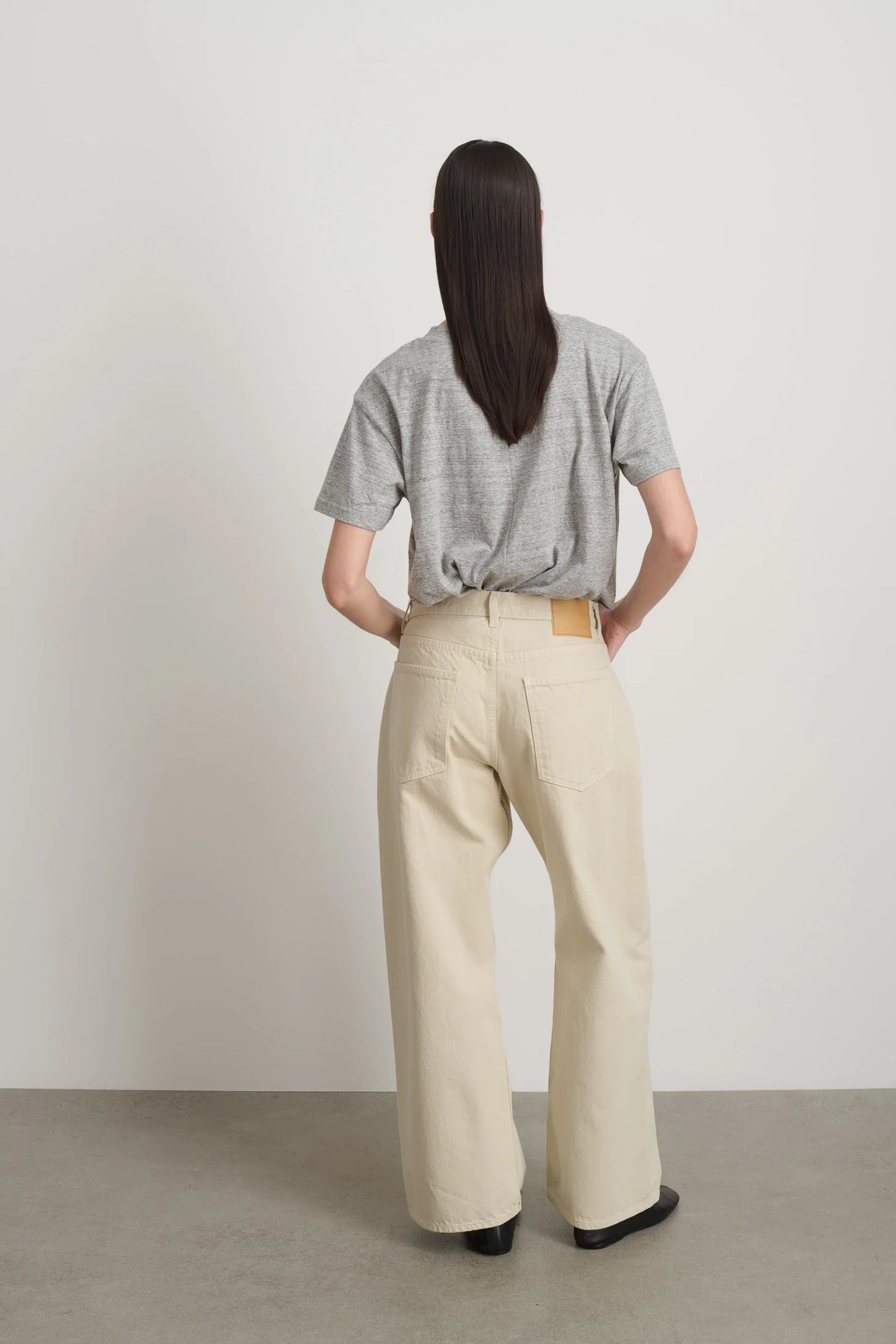 Model is wearing B Sides Floppy Jean Chalk Overdye in wide-leg cotton denim, mid-rise relaxed fit, 28-inch inseam, stonewashed chalk finish, from the curated selection of House of Woven Stories