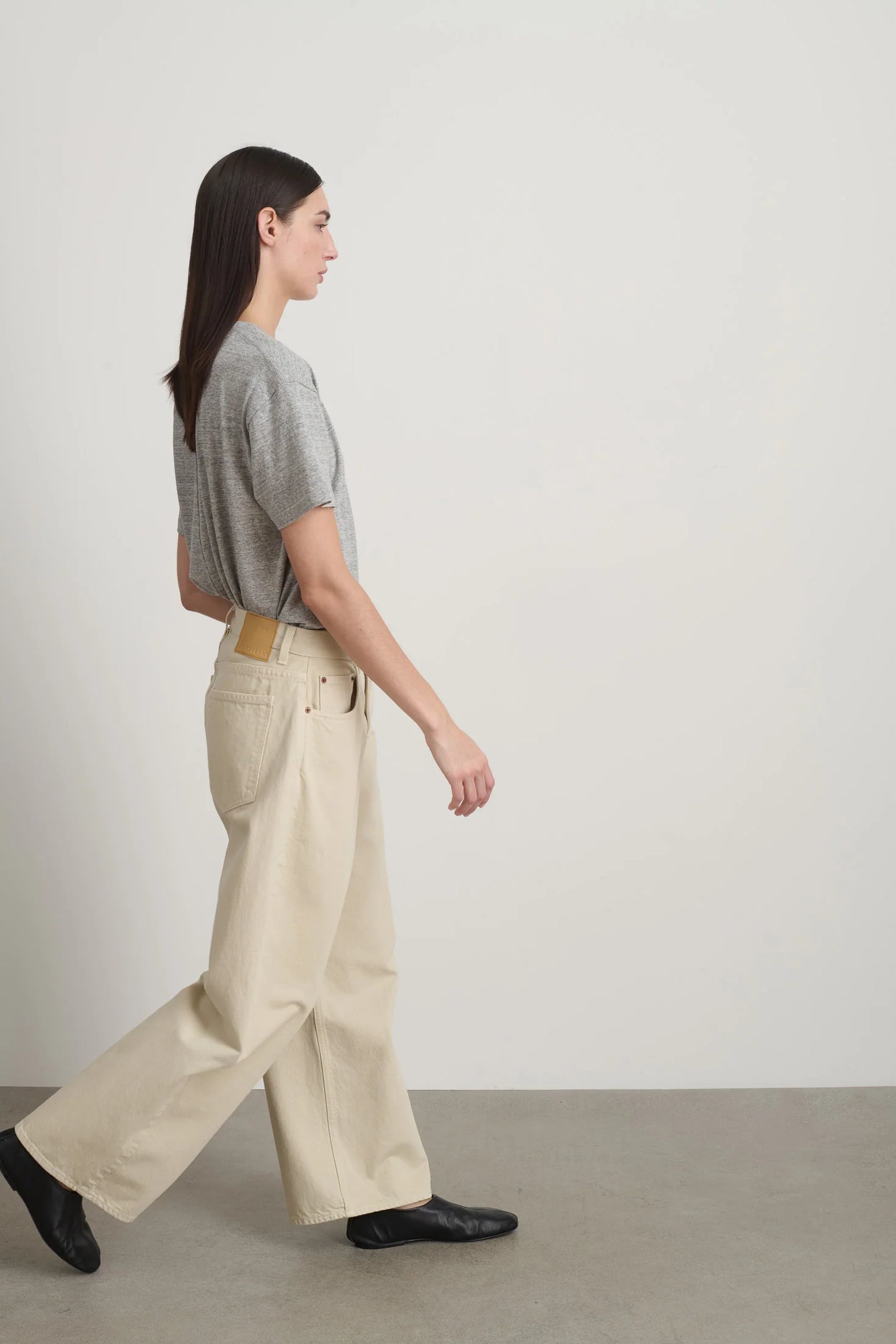 Model is wearing B Sides Floppy Jean Chalk Overdye in wide-leg cotton denim, mid-rise relaxed fit, 28-inch inseam, stonewashed chalk finish, from the curated selection of House of Woven Stories