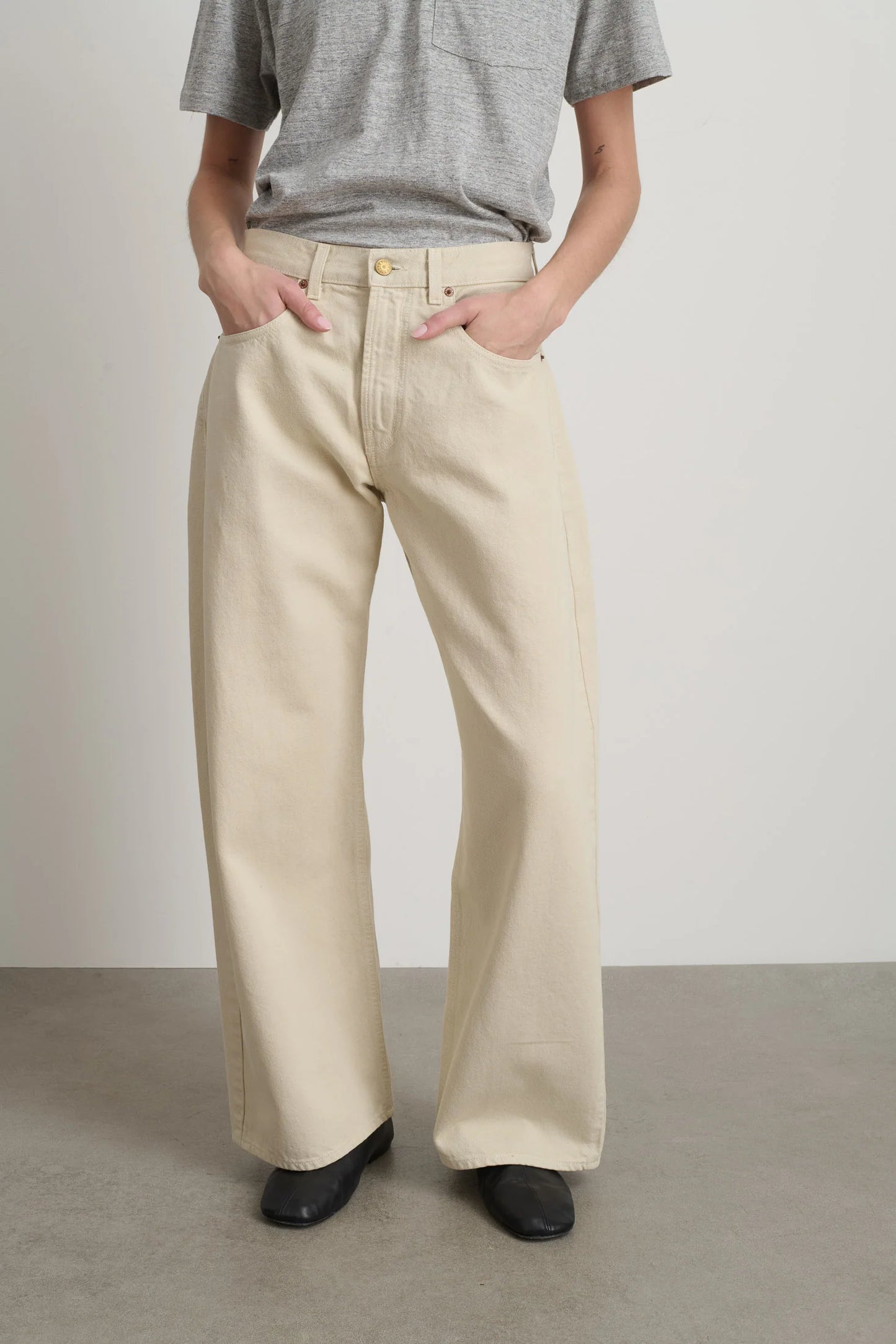 Model is wearing B Sides Floppy Jean Chalk Overdye in wide-leg cotton denim, mid-rise relaxed fit, 28-inch inseam, stonewashed chalk finish, from the curated selection of House of Woven Stories