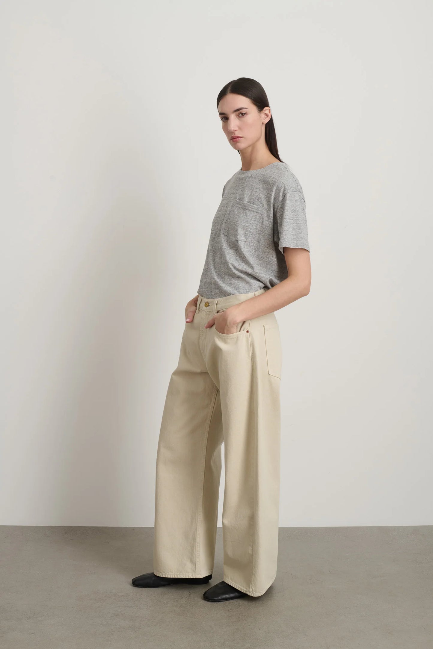 Model is wearing B Sides Floppy Jean Chalk Overdye in wide-leg cotton denim, mid-rise relaxed fit, 28-inch inseam, stonewashed chalk finish, from the curated selection of House of Woven Stories
