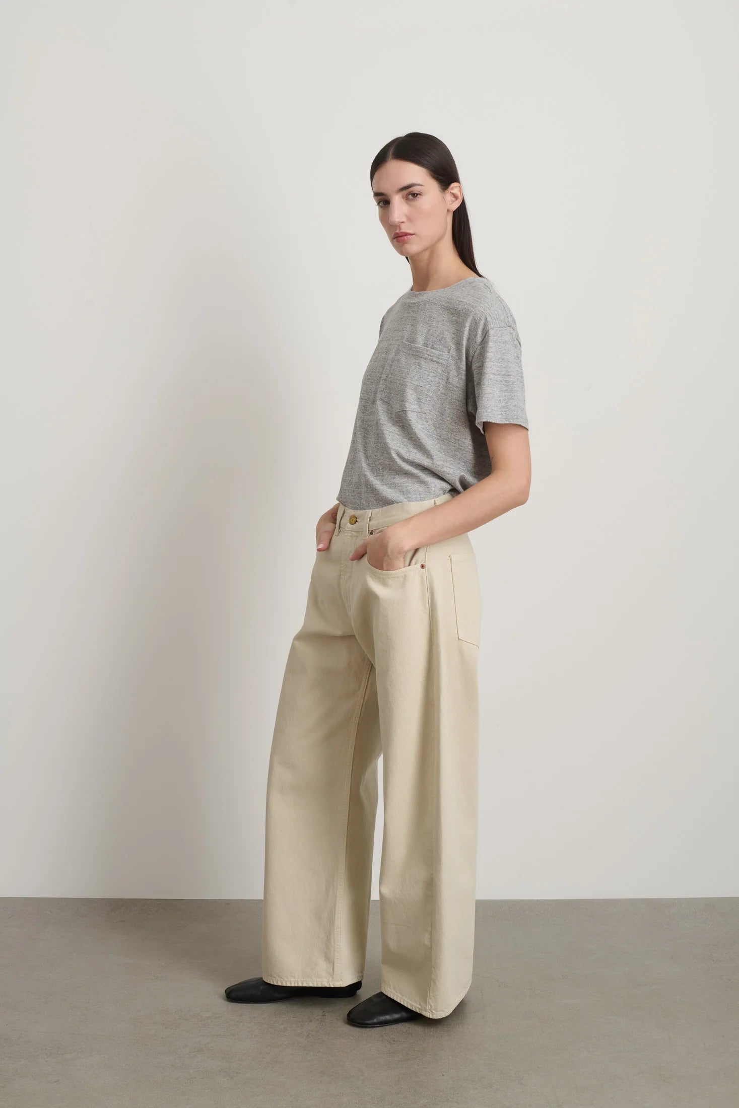 Model is wearing B Sides Floppy Jean Chalk Overdye in wide-leg cotton denim, mid-rise relaxed fit, 28-inch inseam, stonewashed chalk finish, from the curated selection of House of Woven Stories