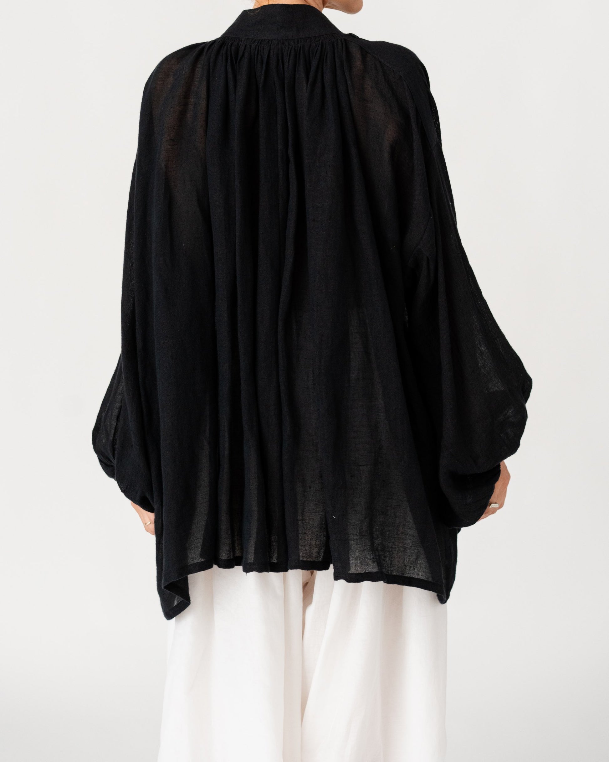 Black Sea Linen Shirt by Les Vacances d’Irina, oversized semi-sheer linen shirt with voluminous sleeves and gathered neckline, handmade in Romania.