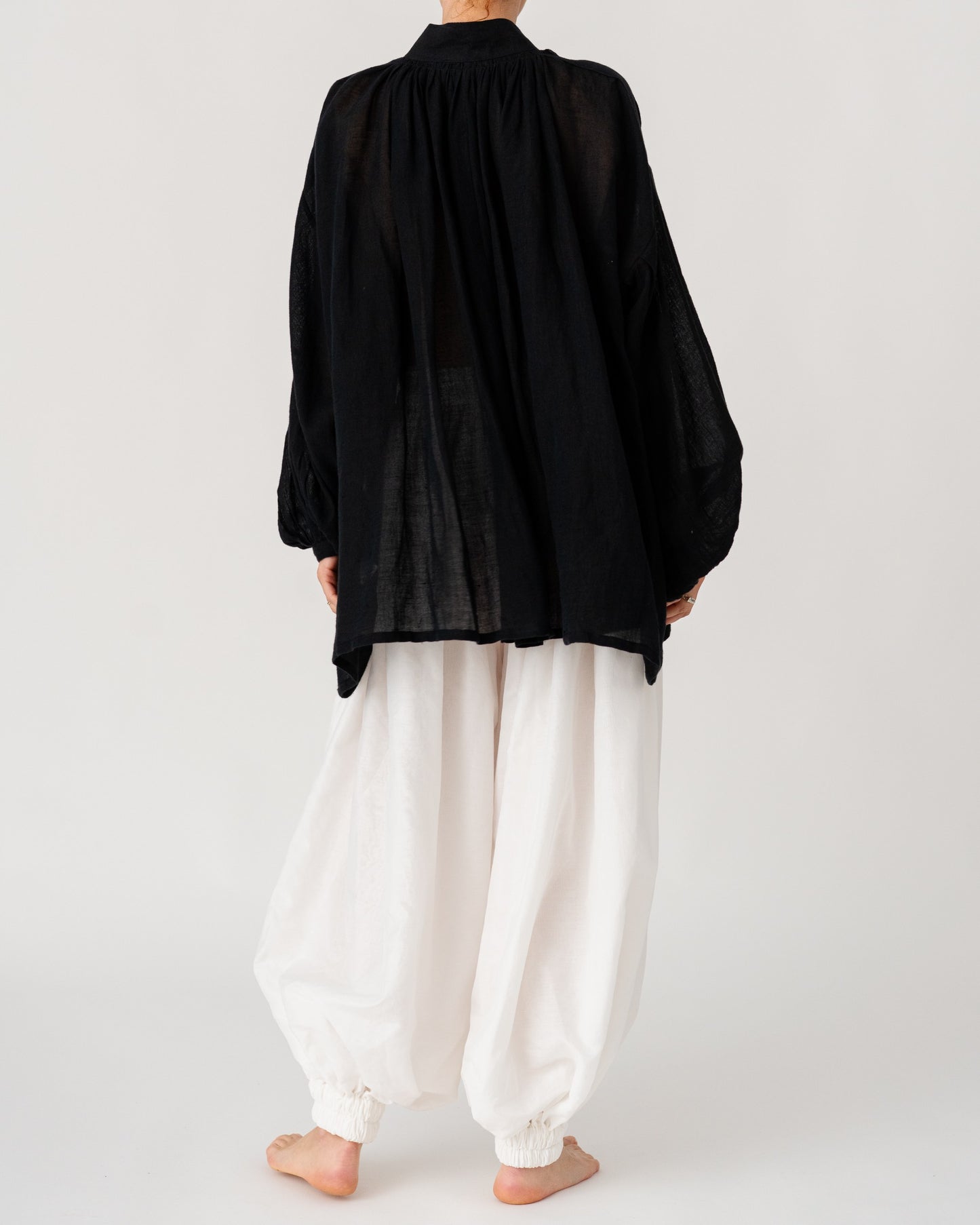 Black Sea Linen Shirt by Les Vacances d’Irina, oversized semi-sheer linen shirt with voluminous sleeves and gathered neckline, handmade in Romania.
