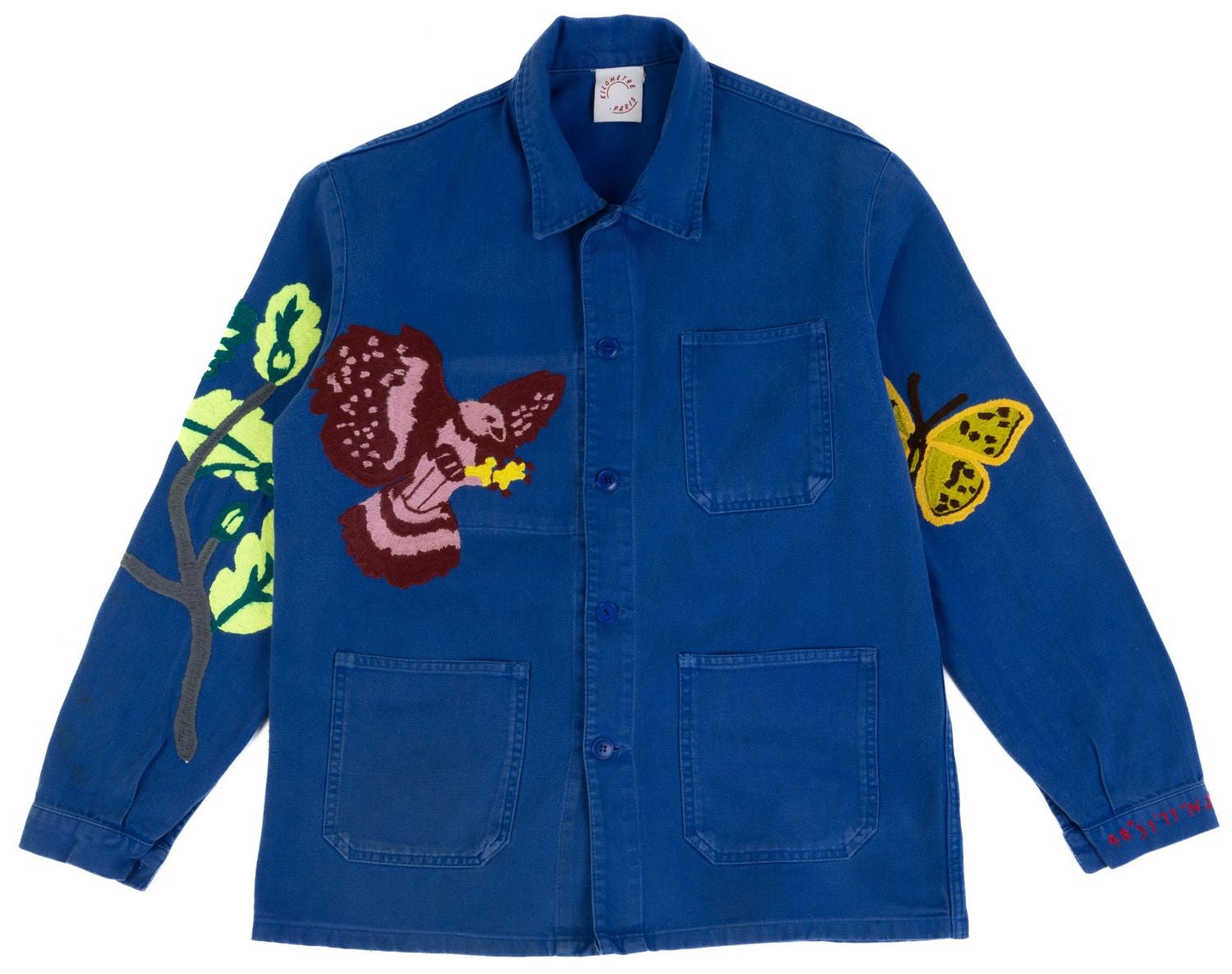 Bleu de Travail vintage French workwear jacket by Kilometre Paris, hand-embroidered with birds and flowers, part of the House of Woven Stories selection.