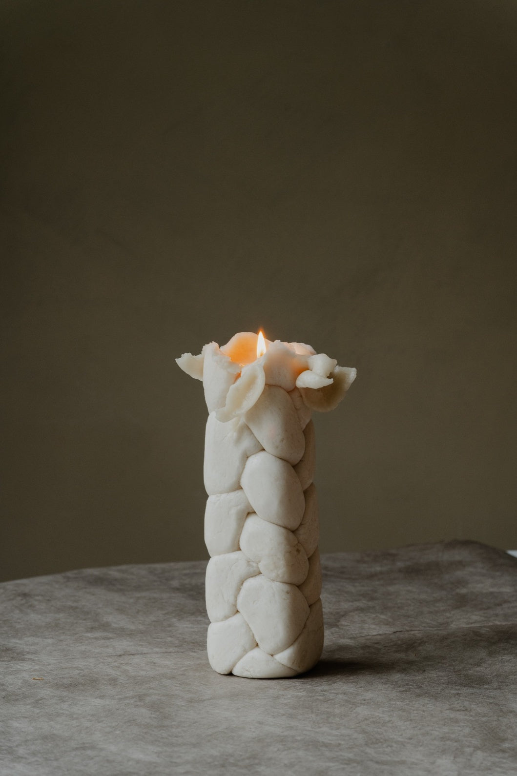 Handcrafted beeswax; irregularities in shape, color, size, and light grey tinge are natural characteristics.