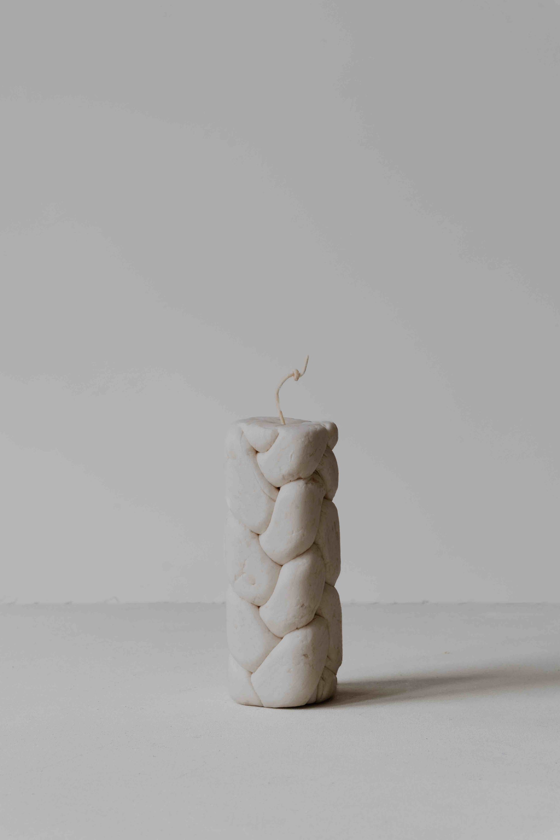 Handcrafted beeswax; irregularities in shape, color, size, and light grey tinge are natural characteristics.