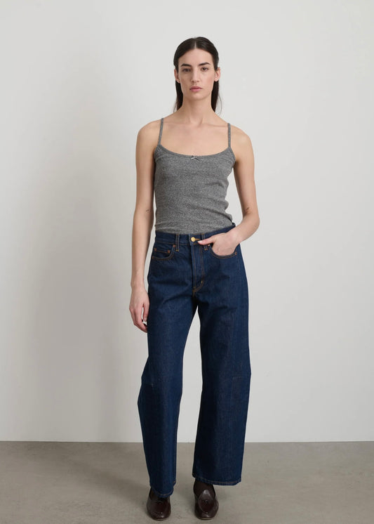 Model is wearing B Sides Lasso Jeans in double-faced Japanese denim, natural waist, kinked leg, cropped length, roped hem, with signature outseam detailing, part of House of Woven Stories curated collection.