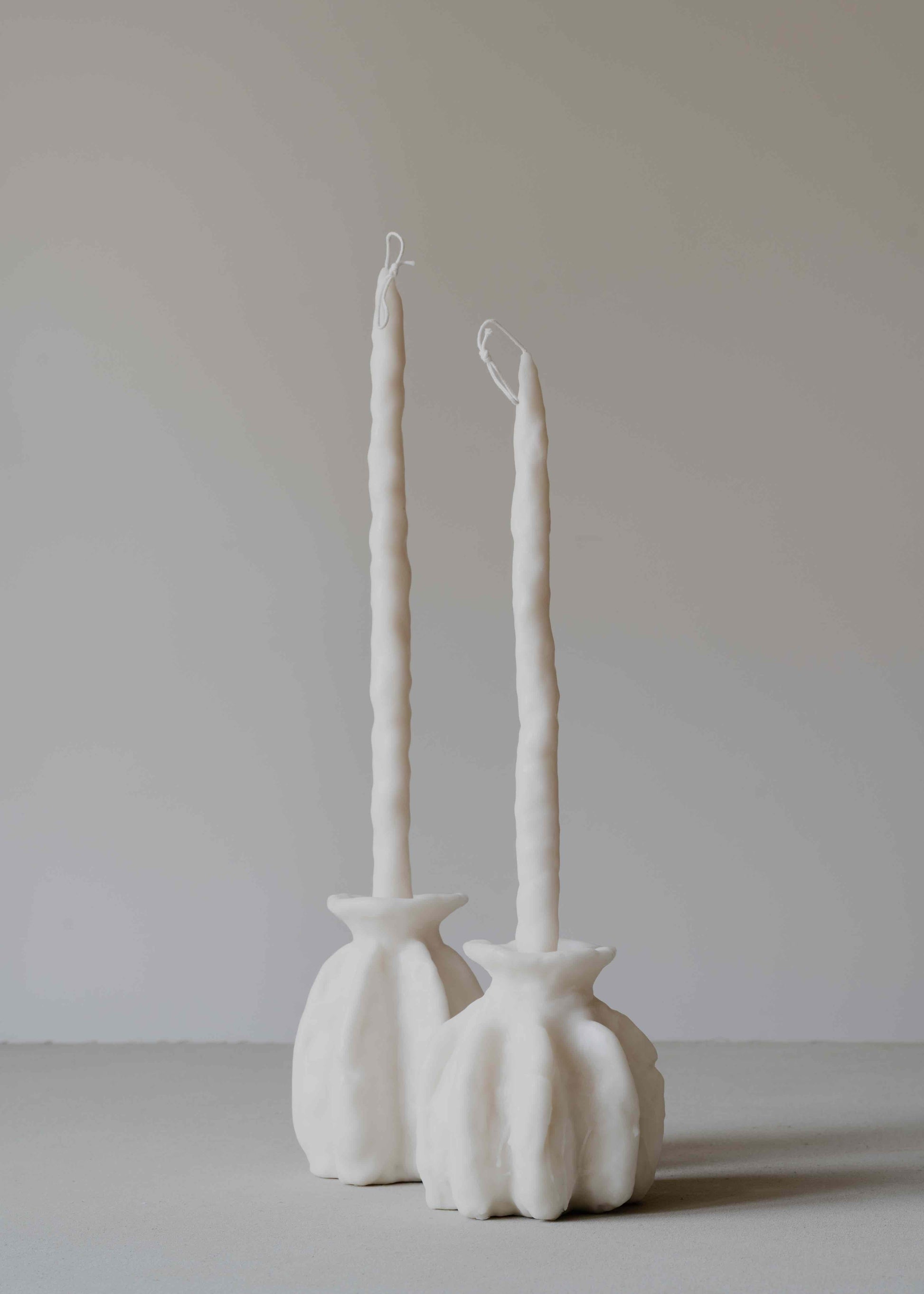 Carambola Low in Cream candle holder by Oberflacht, part of the House of Woven Stories selection, handcrafted from beeswax and paraffin with matching twig candle and subtle variations in colour, shape, and texture.