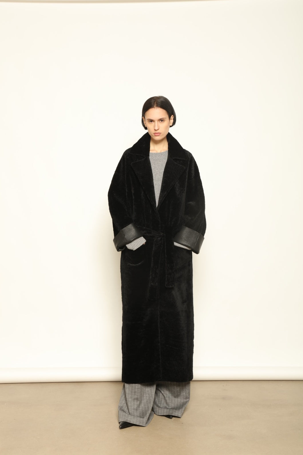 Charlotte Black Sud Africa Astracan Nappa Coat by Novelle – reversible Italian shearling and leather coat handcrafted from South African astrakhan nappa, embodying timeless elegance and sustainable luxury at House of Woven Stories.