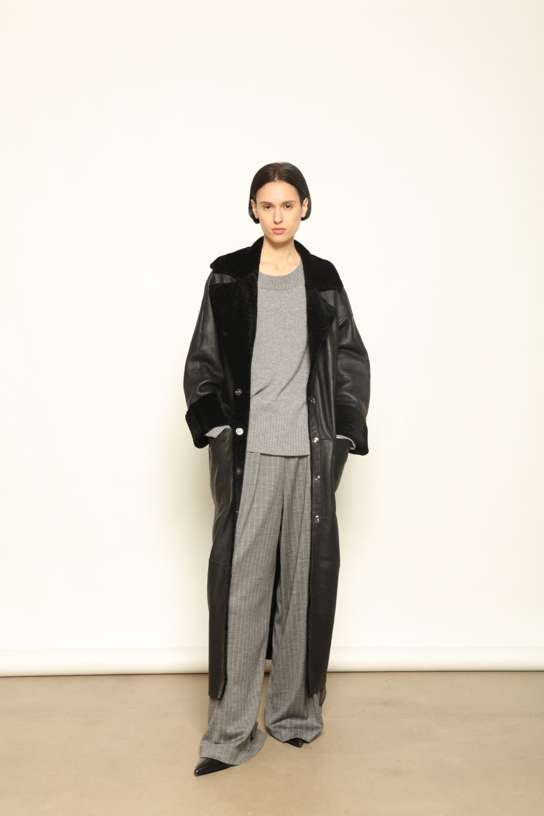 Charlotte Black Sud Africa Astracan Nappa Coat by Novelle – reversible Italian shearling and leather coat handcrafted from South African astrakhan nappa, embodying timeless elegance and sustainable luxury at House of Woven Stories.