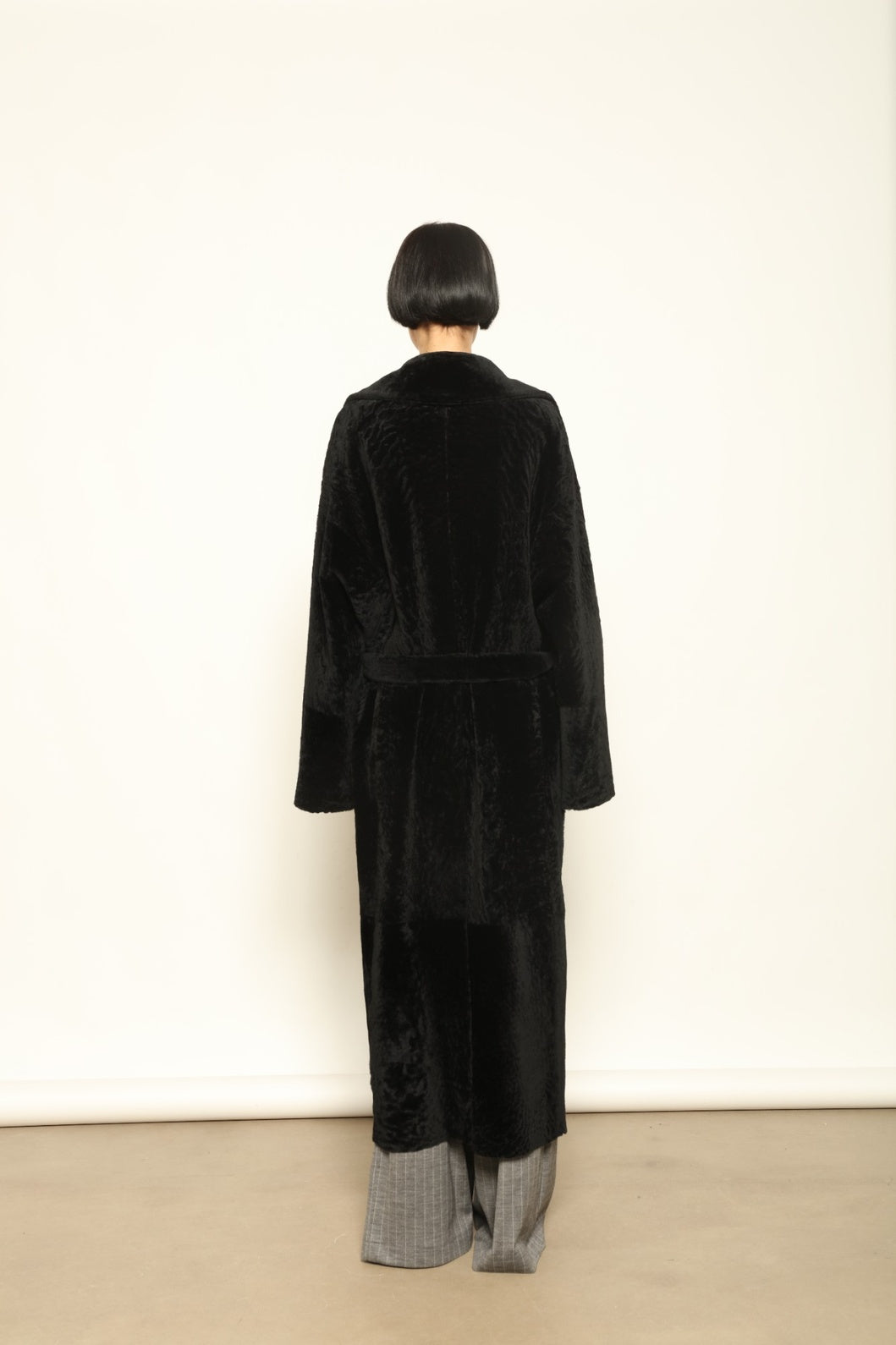 Charlotte Black Sud Africa Astracan Nappa Coat by Novelle – reversible Italian shearling and leather coat handcrafted from South African astrakhan nappa, embodying timeless elegance and sustainable luxury at House of Woven Stories.