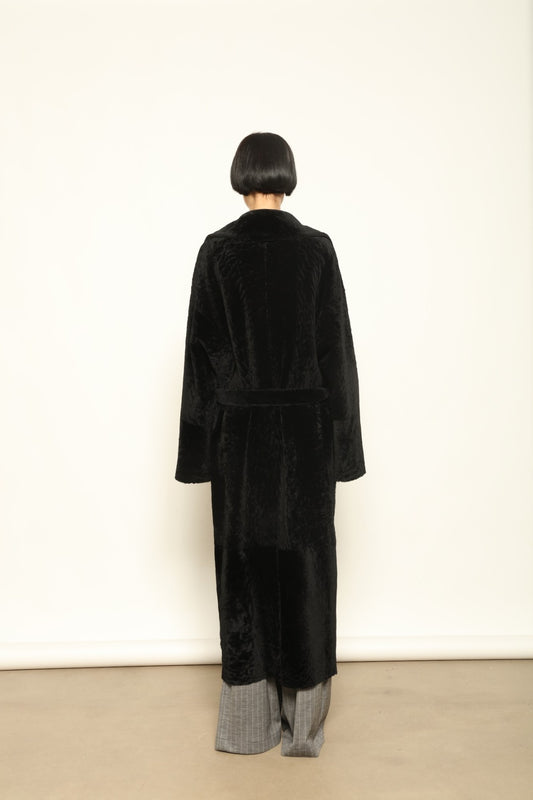 Charlotte Black Sud Africa Astracan Nappa Coat by Novelle – reversible Italian shearling and leather coat handcrafted from South African astrakhan nappa, embodying timeless elegance and sustainable luxury at House of Woven Stories.