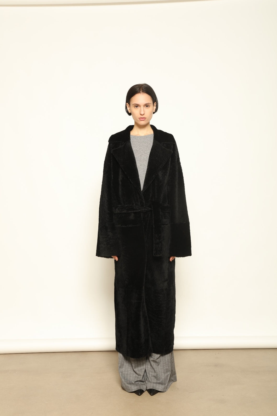 Charlotte Black Sud Africa Astracan Nappa Coat by Novelle – reversible Italian shearling and leather coat handcrafted from South African astrakhan nappa, embodying timeless elegance and sustainable luxury at House of Woven Stories.