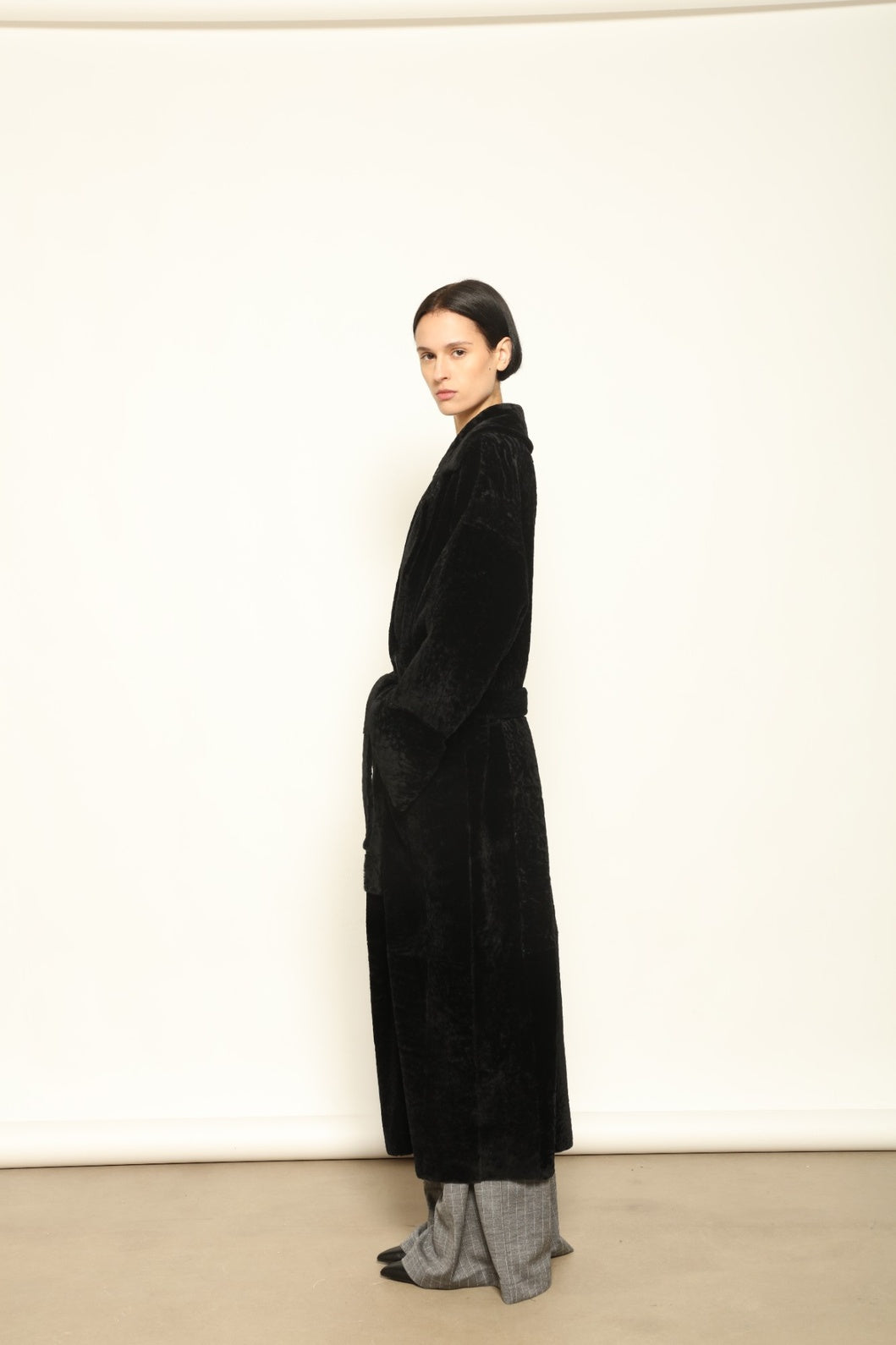 Charlotte Black Sud Africa Astracan Nappa Coat by Novelle – reversible Italian shearling and leather coat handcrafted from South African astrakhan nappa, embodying timeless elegance and sustainable luxury at House of Woven Stories.