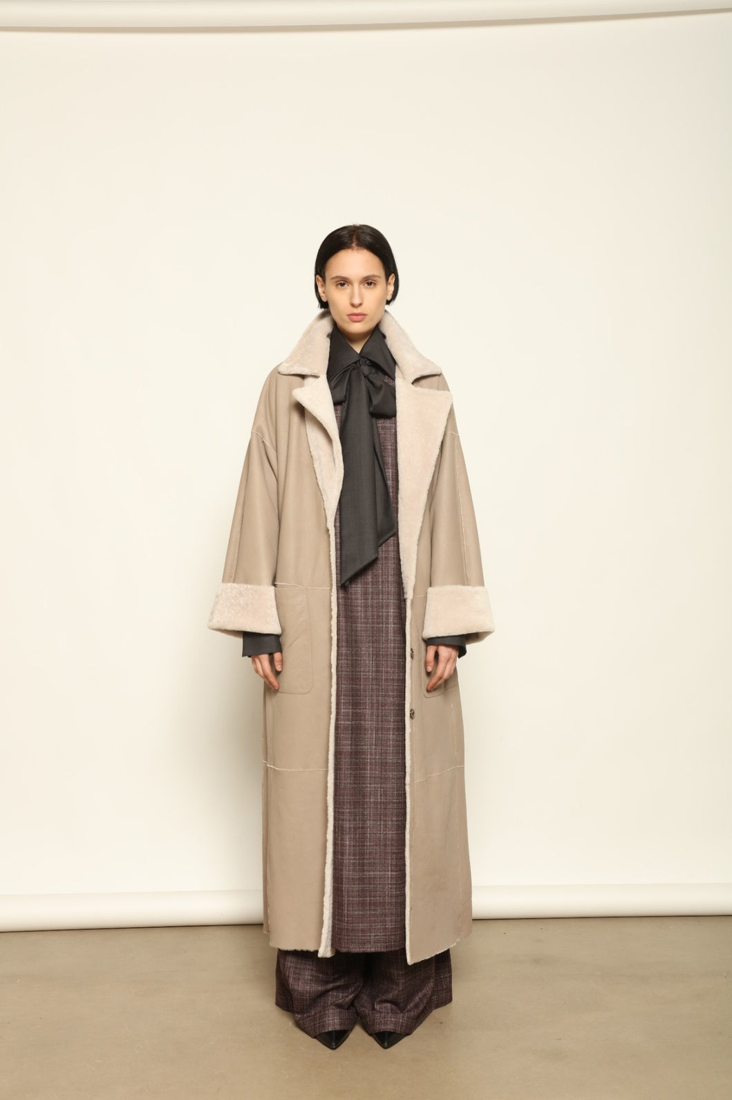 Charlotte Grey Sud Africa Astracan Nappa Coat by Novelle – reversible Italian shearling and leather coat in natural greige tone, handcrafted from astrakhan nappa and wool for timeless elegance and sustainable luxury at House of Woven Stories.