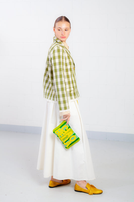 Model is wearing the Pine Checked Cotton and Linen Jacket by Balia 8.22, featuring a classic tailored fit, pine green and white checked pattern, and breathable Italian craftsmanship.