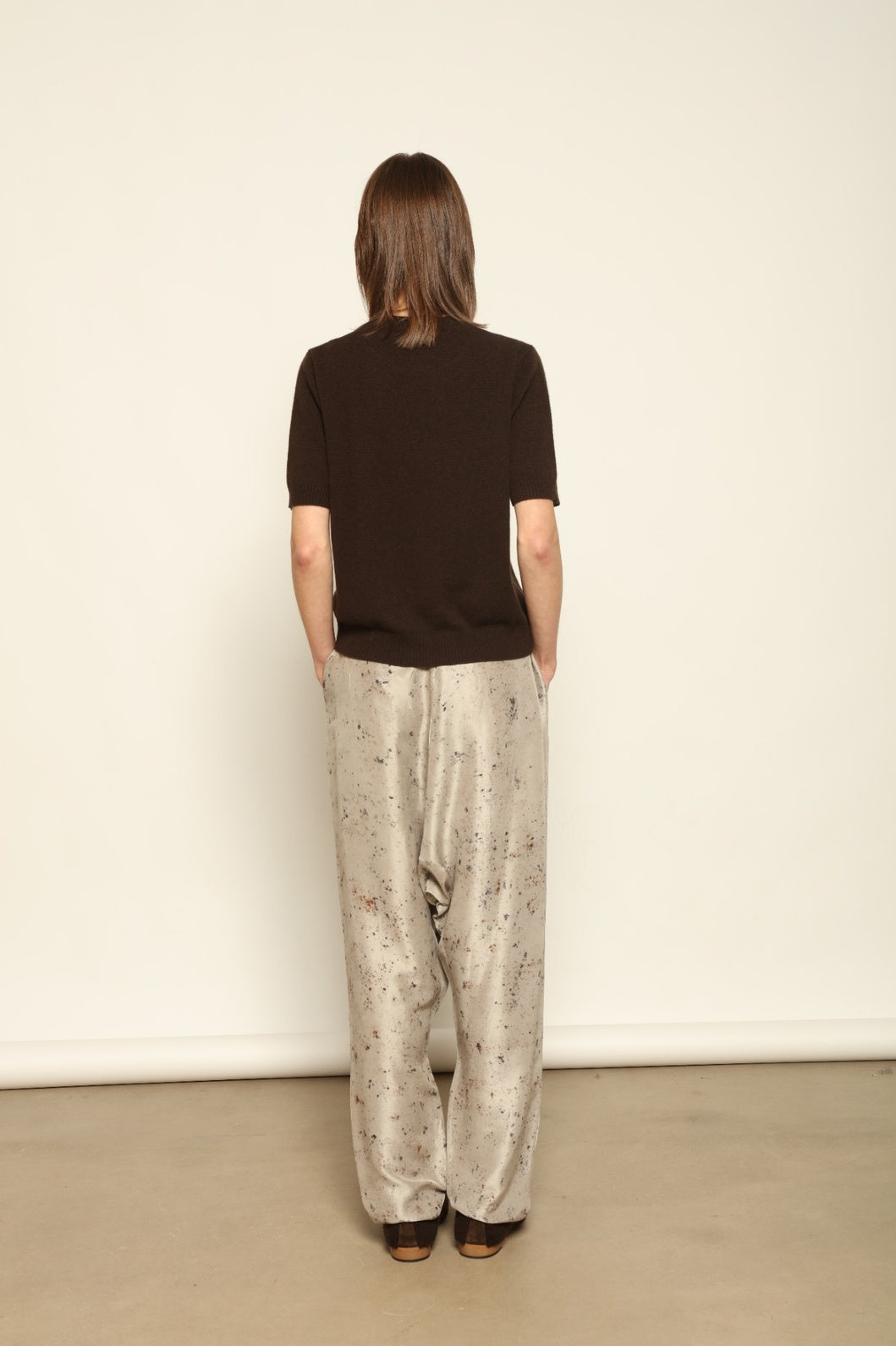 Model wearing the Chocolate Natascha Round Neck Cashmere Pullover by House of Woven Stories, crafted from 100% Inner Mongolia cashmere, featuring a relaxed fit, smooth texture, and sustainable luxury knitwear in rich chocolate tone