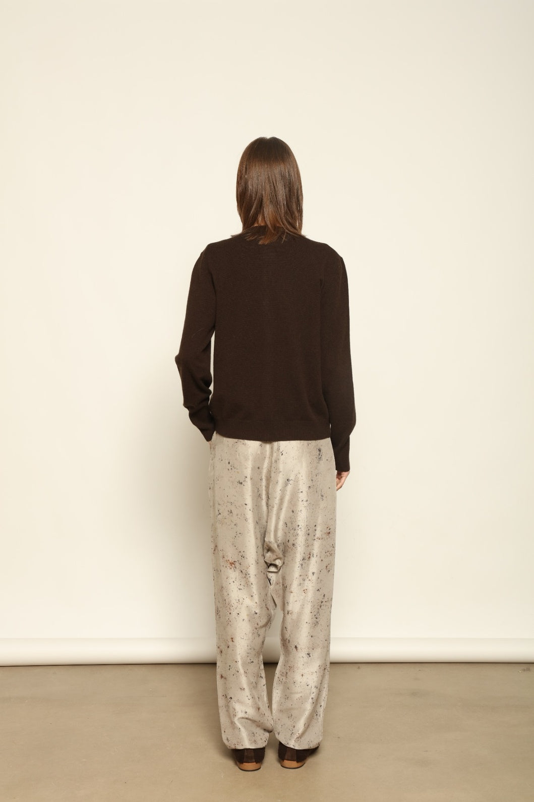 Model wearing the Chocolate Nathalie Open-Front Cashmere Cardigan by House of Woven Stories, crafted from 100% Inner Mongolia cashmere, featuring a relaxed silhouette, smooth texture, and sustainable luxury knitwear in rich chocolate tone