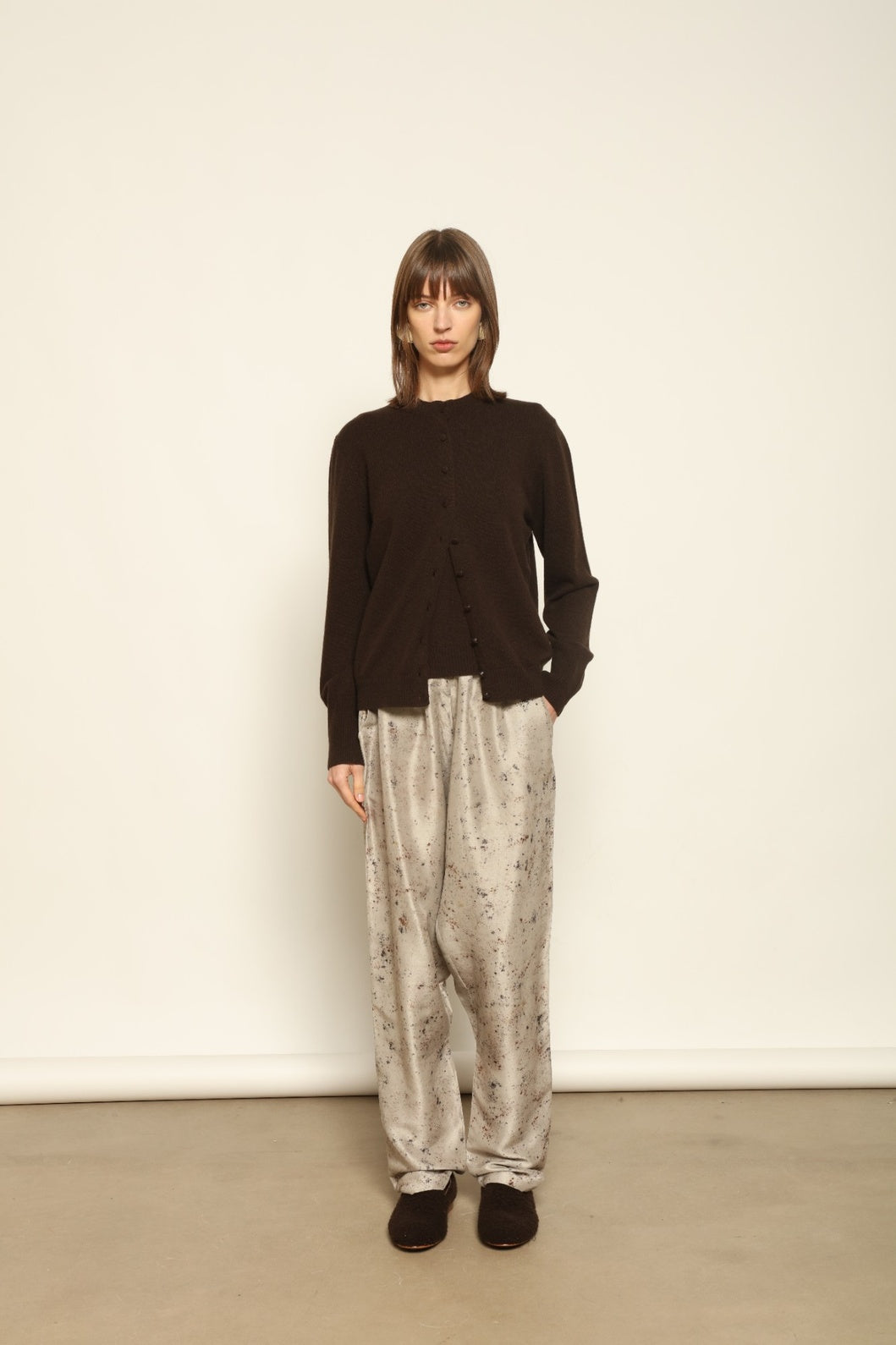 Model wearing the Chocolate Nathalie Open-Front Cashmere Cardigan by House of Woven Stories, crafted from 100% Inner Mongolia cashmere, featuring a relaxed silhouette, smooth texture, and sustainable luxury knitwear in rich chocolate tone