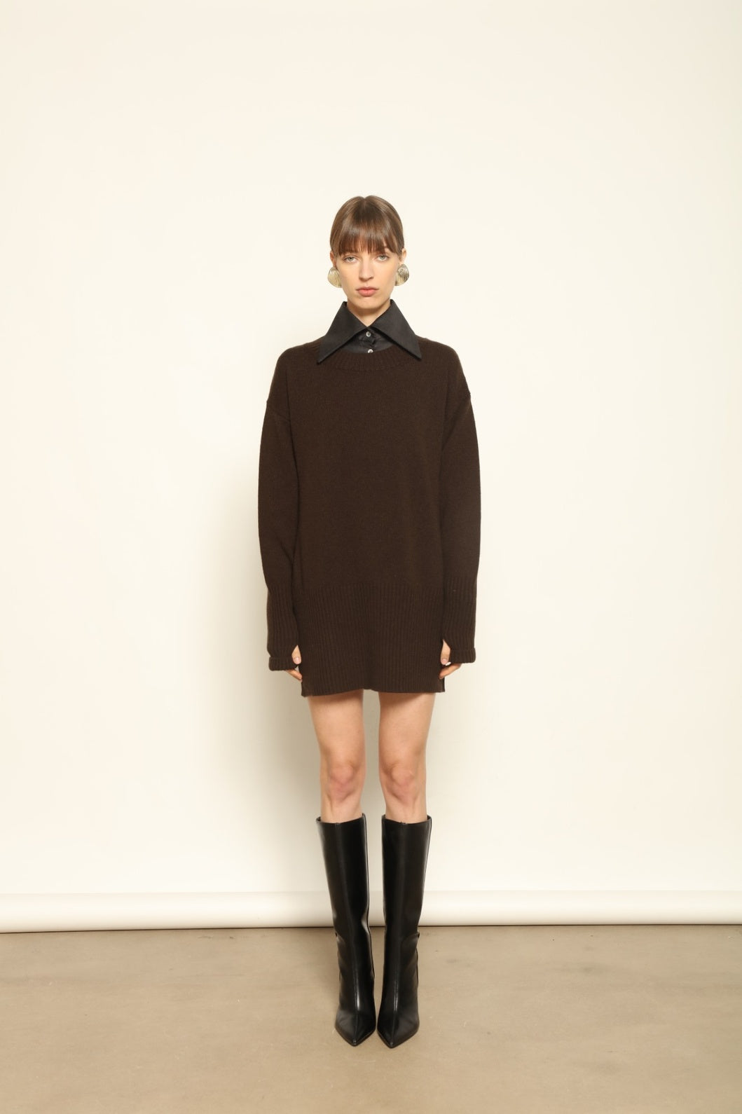 Model wearing the Chocolate Noemi Round Neck Cashmere Pullover by House of Woven Stories, made from 100% pure Inner Mongolia cashmere, featuring a deep chocolate tone, soft texture, relaxed fit, and sustainable luxury craftsmanship