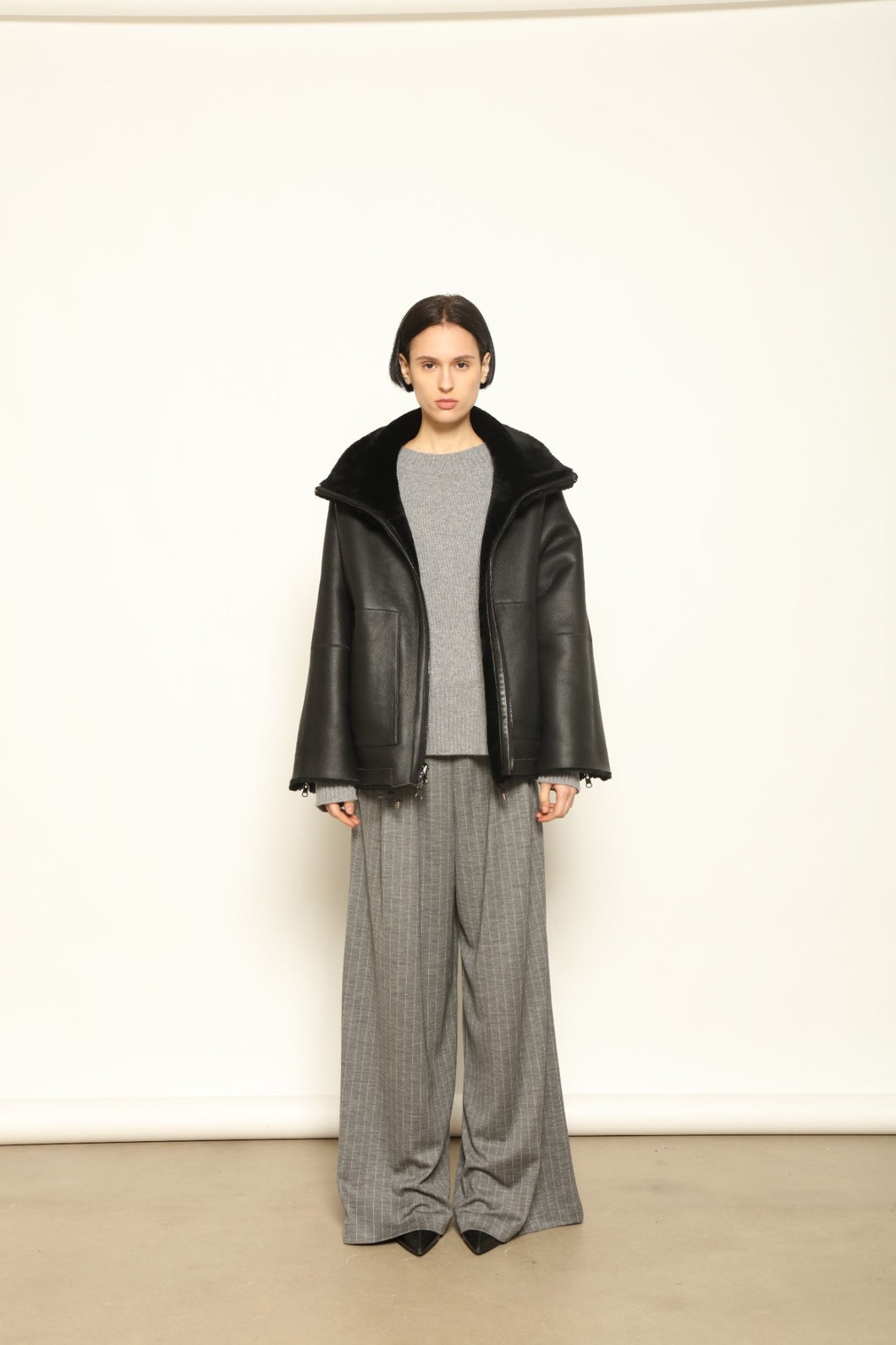 Colette Sud Africa Ironed Black Nappa Jacket by Novelle – reversible Italian shearling and nappa leather jacket in polished black, handcrafted for timeless elegance at House of Woven Stories.