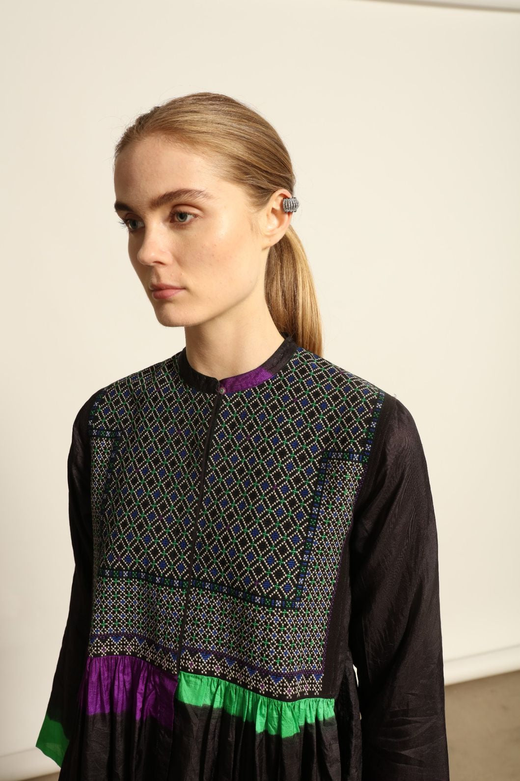 Model is wearing Folklore 10 Handmade Cotton and Silk Dress by Injiri, part of the House of Woven Stories selection, crafted in India from a cotton and silk blend with round neckline, long sleeves, side pockets, and artisanal detailing.