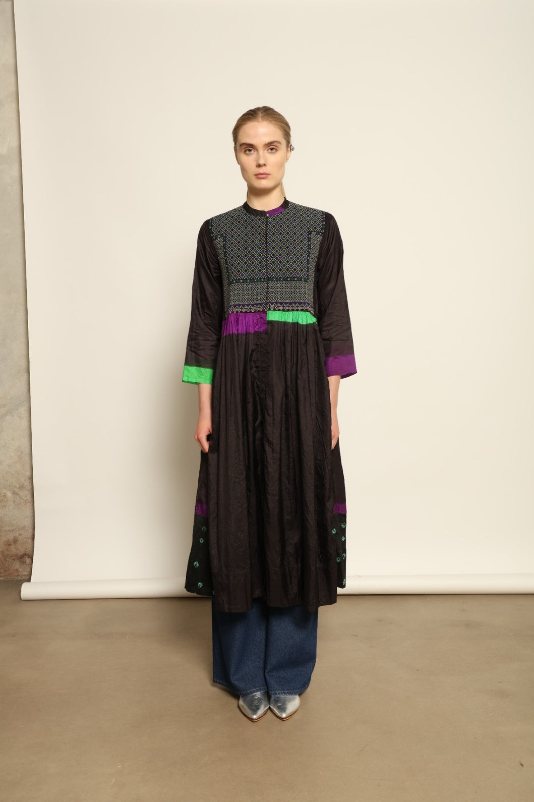 Model is wearing Folklore 10 Handmade Cotton and Silk Dress by Injiri, part of the House of Woven Stories selection, crafted in India from a cotton and silk blend with round neckline, long sleeves, side pockets, and artisanal detailing.