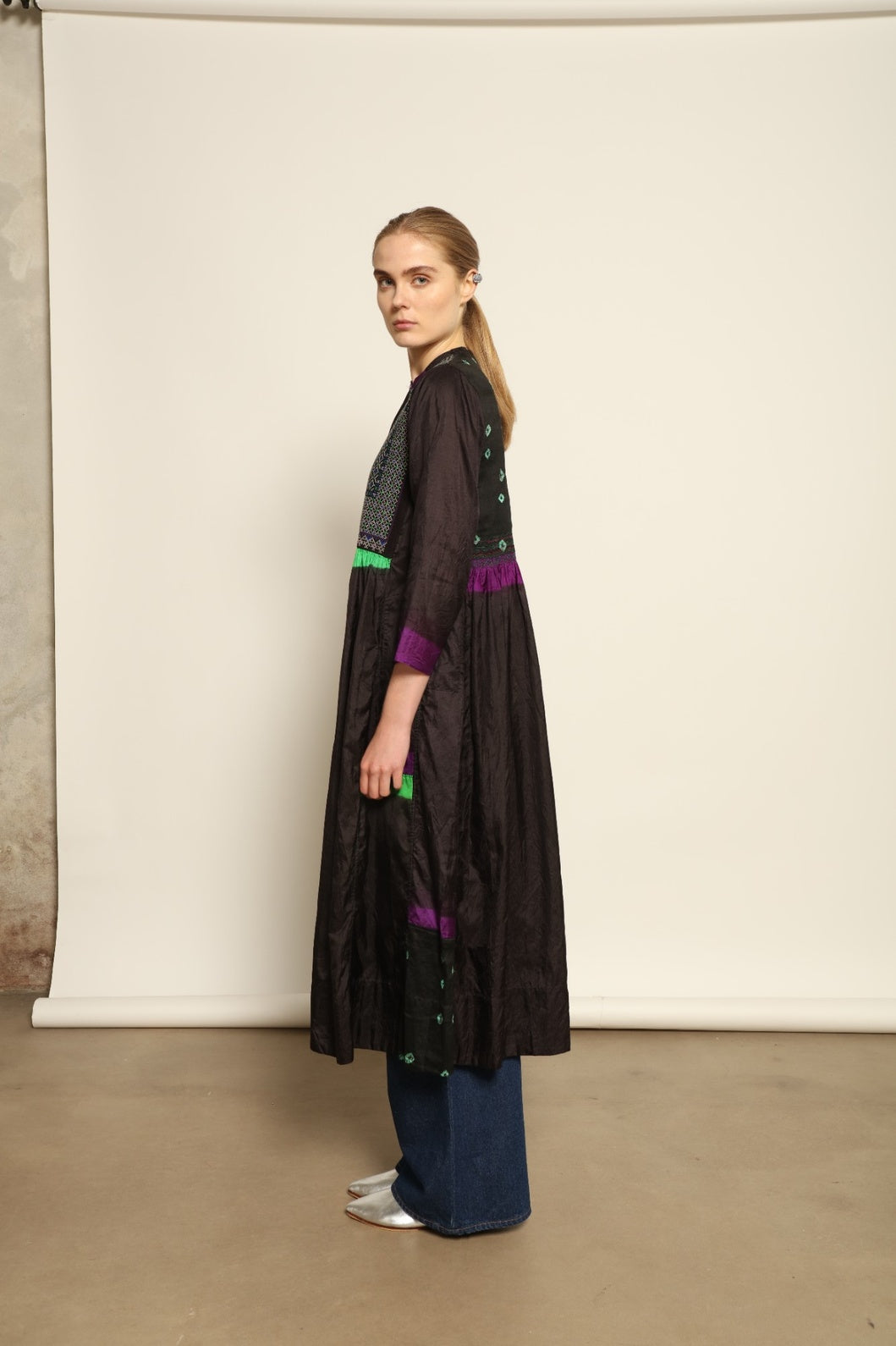 Model is wearing Folklore 10 Handmade Cotton and Silk Dress by Injiri, part of the House of Woven Stories selection, crafted in India from a cotton and silk blend with round neckline, long sleeves, side pockets, and artisanal detailing.