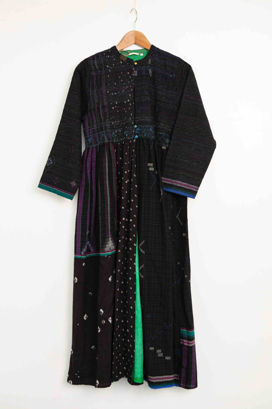 Model is wearing the Folklore 20 handloomed silk and wool dress by Injiri, featuring a flattering cut, long sleeves, side pockets, and artisan-made handloomed fabric.