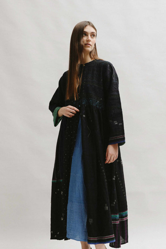 Model is wearing the Folklore 20 handloomed silk and wool dress by Injiri, featuring a flattering cut, long sleeves, side pockets, and artisan-made handloomed fabric.