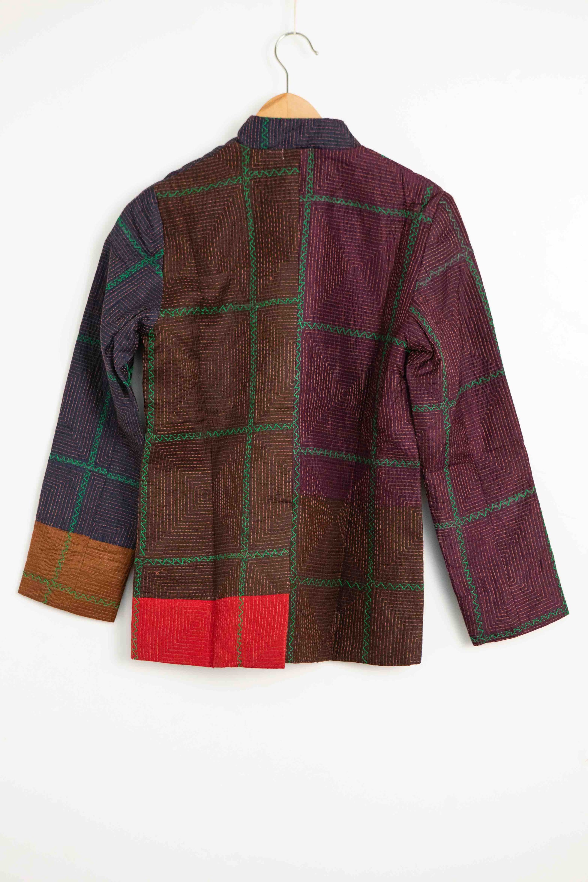 Model is wearing the Folklore 82 silk hand-loomed jacket by Injiri, featuring lightweight silk, refined tailoring, and artisanal craftsmanship, handmade in India. Part of House of Woven Stories selection.