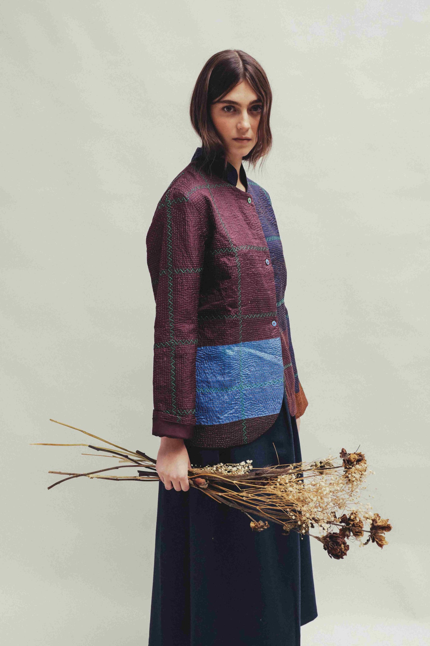 Model is wearing the Folklore 82 silk hand-loomed jacket by Injiri, featuring lightweight silk, refined tailoring, and artisanal craftsmanship, handmade in India. Part of House of Woven Stories selection.