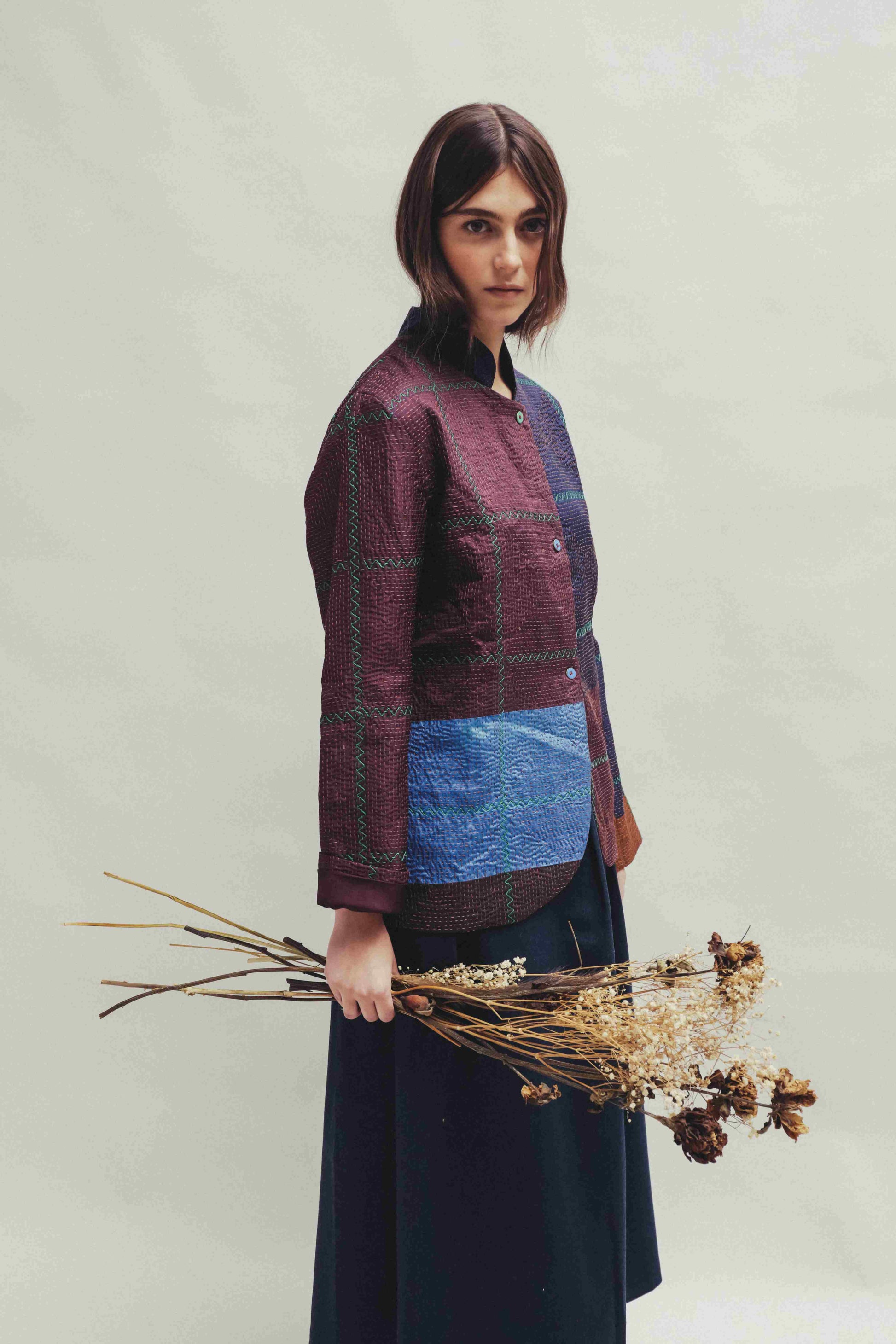 Model is wearing the Folklore 82 silk hand-loomed jacket by Injiri, featuring lightweight silk, refined tailoring, and artisanal craftsmanship, handmade in India. Part of House of Woven Stories selection.