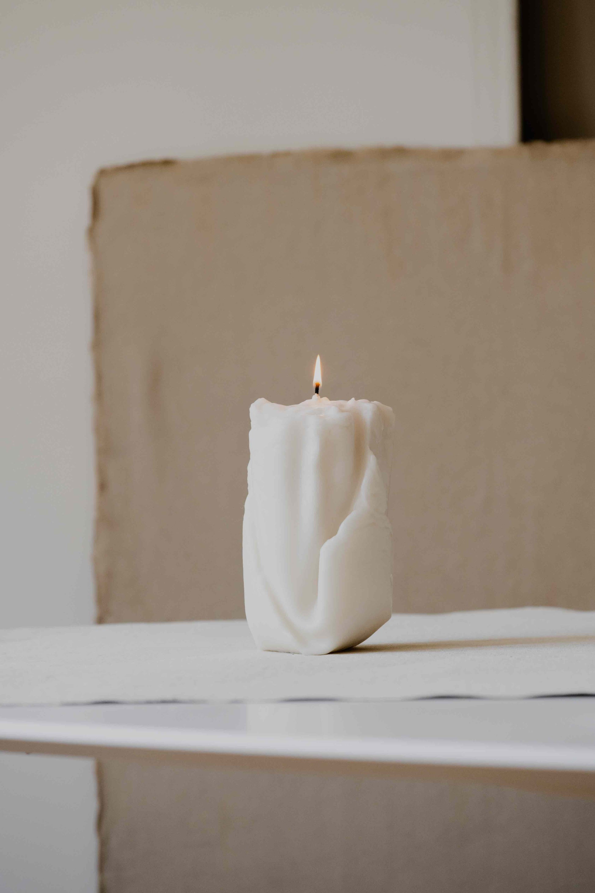 Ghost in Cream by Oberflacht, part of the House of Woven Stories selection. Handcrafted from beeswax and paraffin with soft matte finish, sculptural form, and unique artisanal variations.