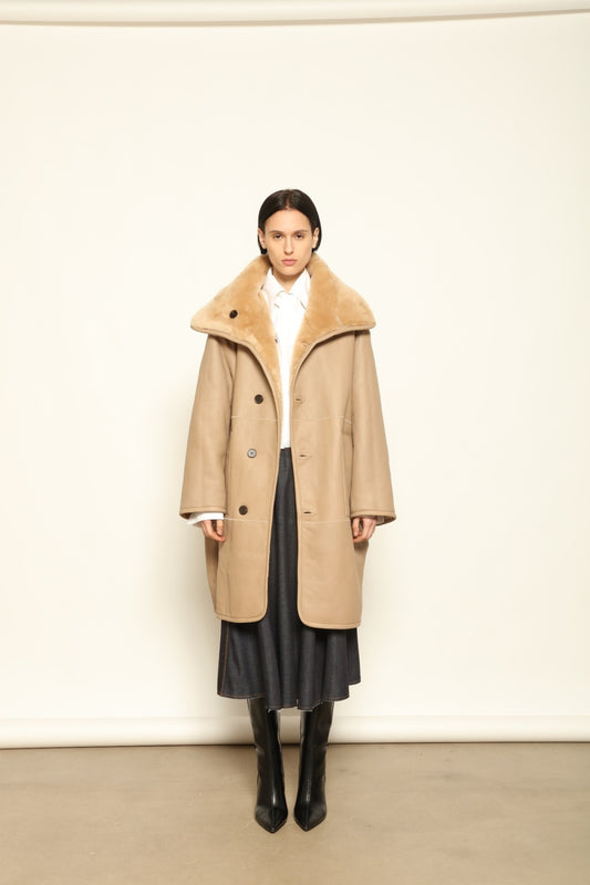 Giselle Camel Long Silky Peach Jacket by Novelle – handcrafted reversible Italian coat in nappa leather and shearling, photographed in soft natural light for House of Woven Stories.