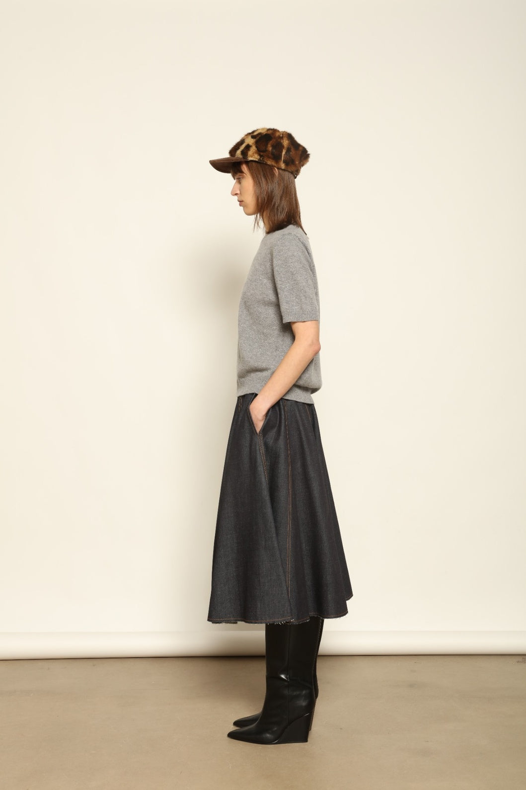 Model wearing the Graphite Natascha Round Neck Cashmere Pullover by House of Woven Stories, crafted from 100% pure Inner Mongolia cashmere, featuring a deep graphite grey tone, soft breathable texture, relaxed fit, and sustainable luxury craftsmanship