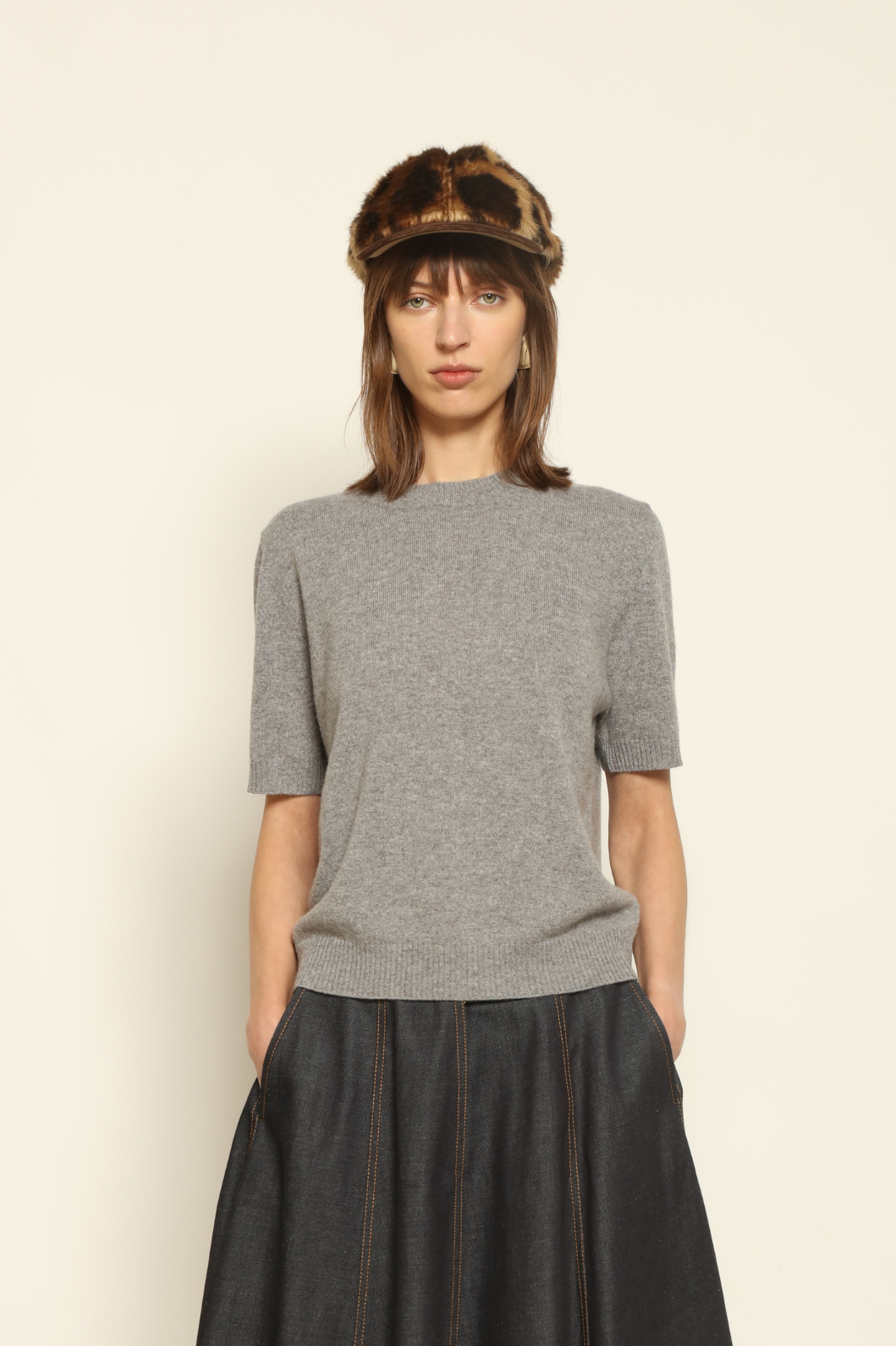 Model wearing the Graphite Natascha Round Neck Cashmere Pullover by House of Woven Stories, crafted from 100% pure Inner Mongolia cashmere, featuring a deep graphite grey tone, soft breathable texture, relaxed fit, and sustainable luxury craftsmanship