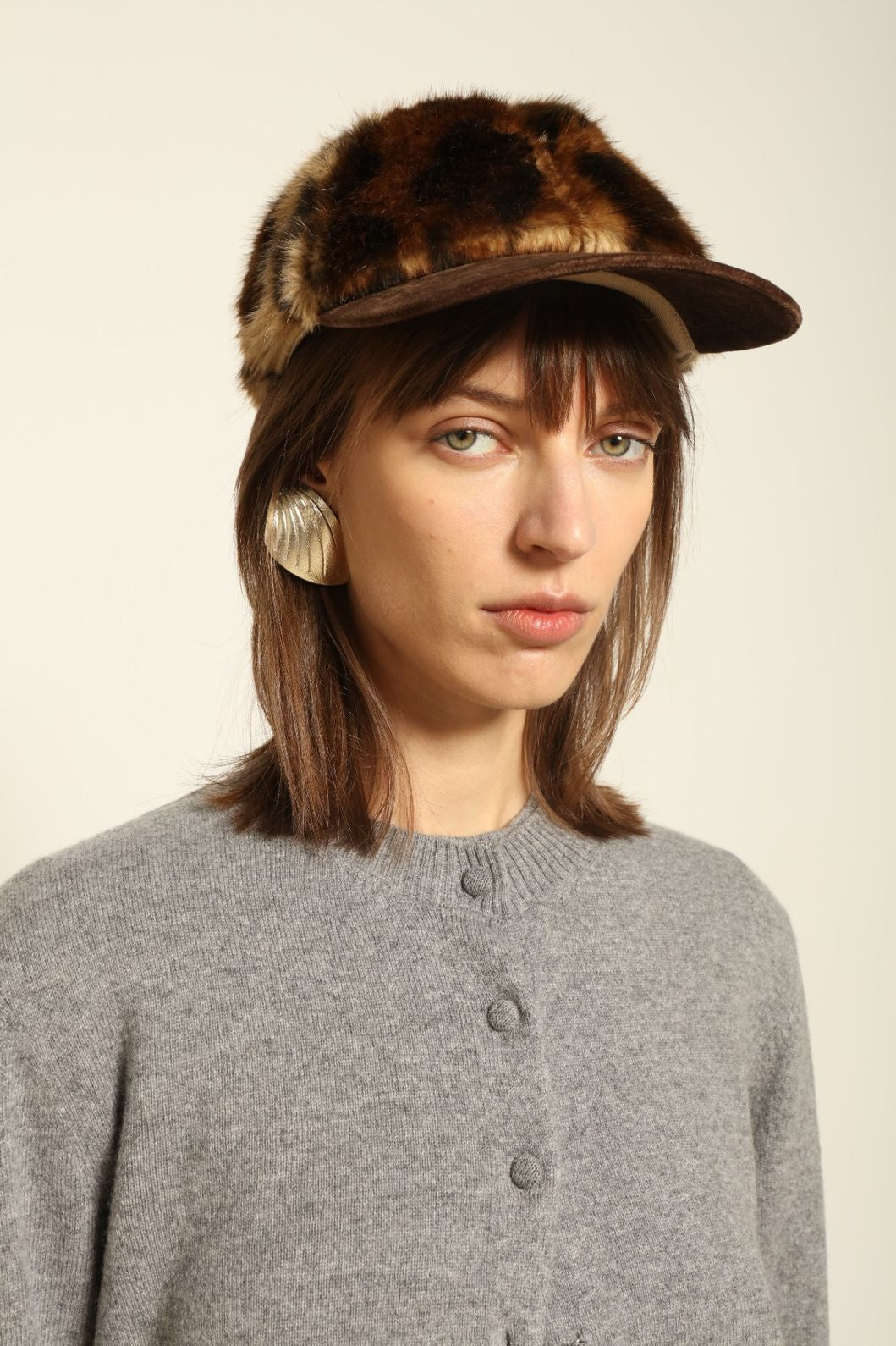 Model wearing the Graphite Nathalie Cashmere Cardigan by House of Woven Stories, made from 100% pure Inner Mongolia cashmere, featuring a deep graphite grey tone, soft breathable texture, open-front silhouette, and sustainable luxury craftsmanship