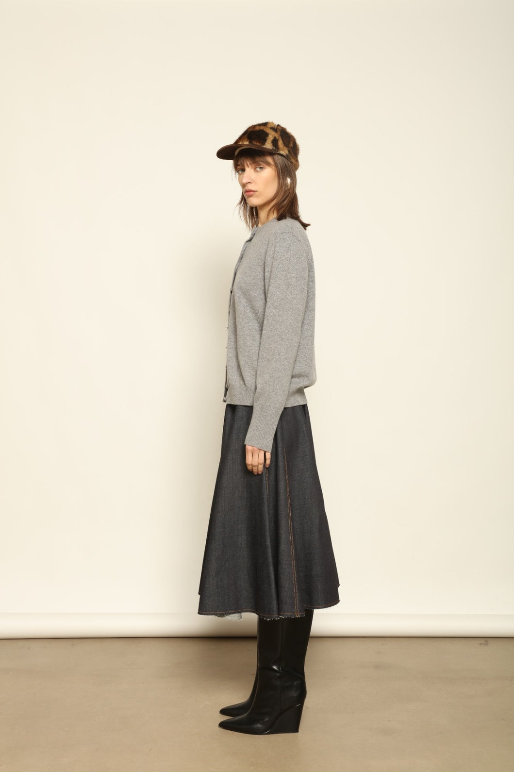 Model wearing the Graphite Nathalie Cashmere Cardigan by House of Woven Stories, made from 100% pure Inner Mongolia cashmere, featuring a deep graphite grey tone, soft breathable texture, open-front silhouette, and sustainable luxury craftsmanship