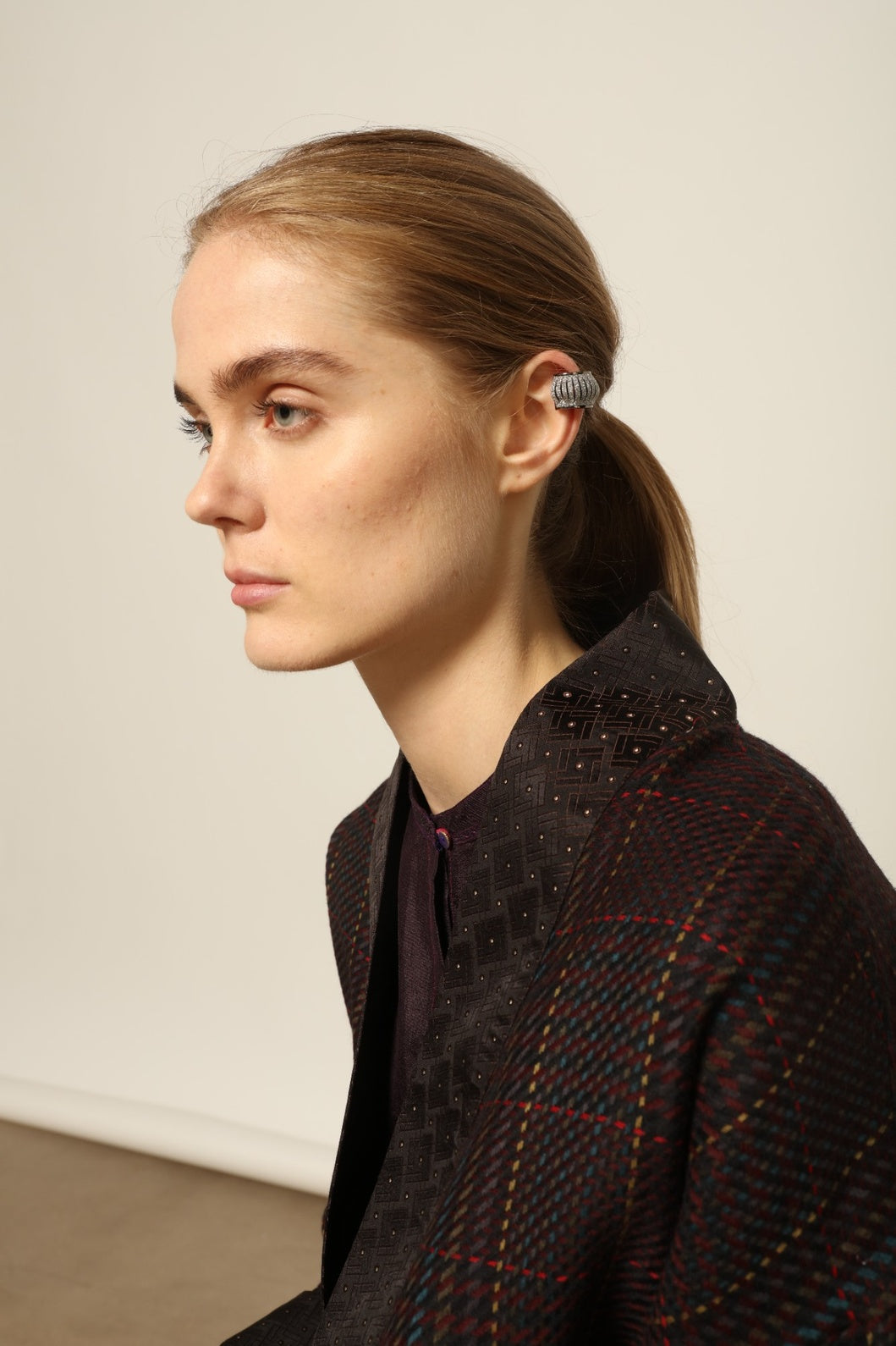 Model is wearing the Harmony Kantha Jacket by Obidi, made from reused sari fabric with traditional kantha hand-stitching, combining heritage craftsmanship with a contemporary silhouette.